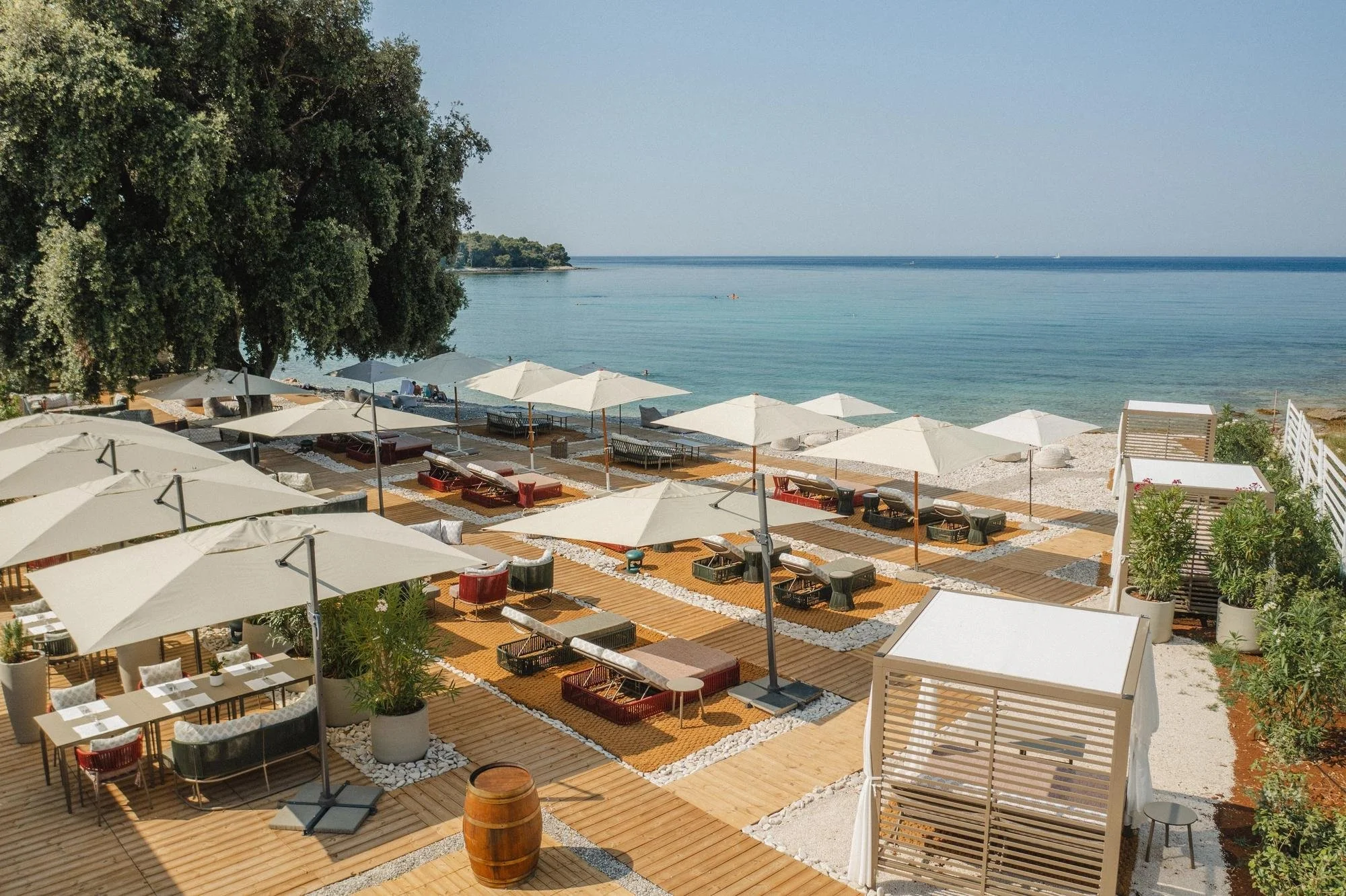 13-meneghetti-beach-club-terraces-beside-the-sea.jpg