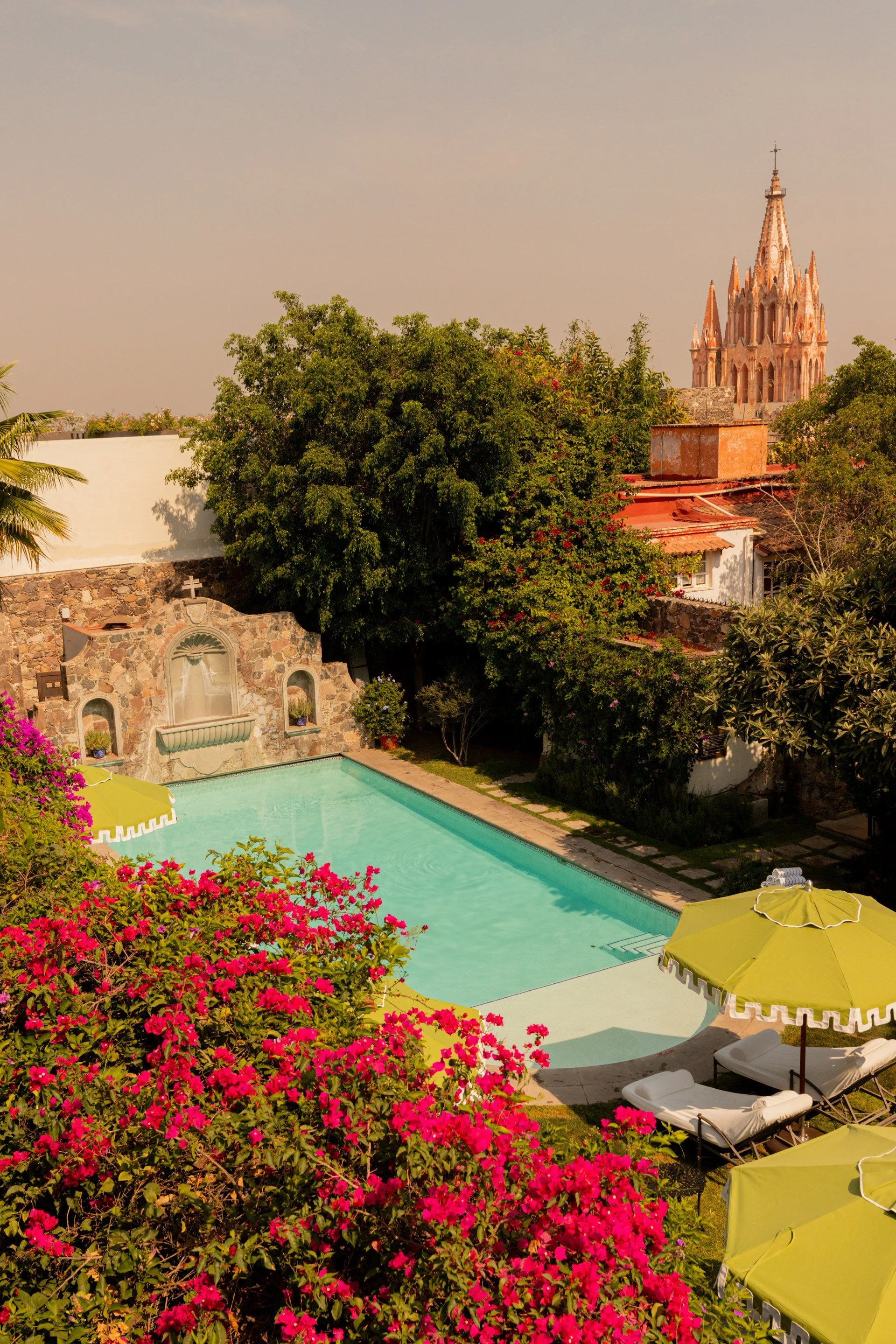 01-hotel-pool-and-gardens-with-parroquia-skyline.jpg