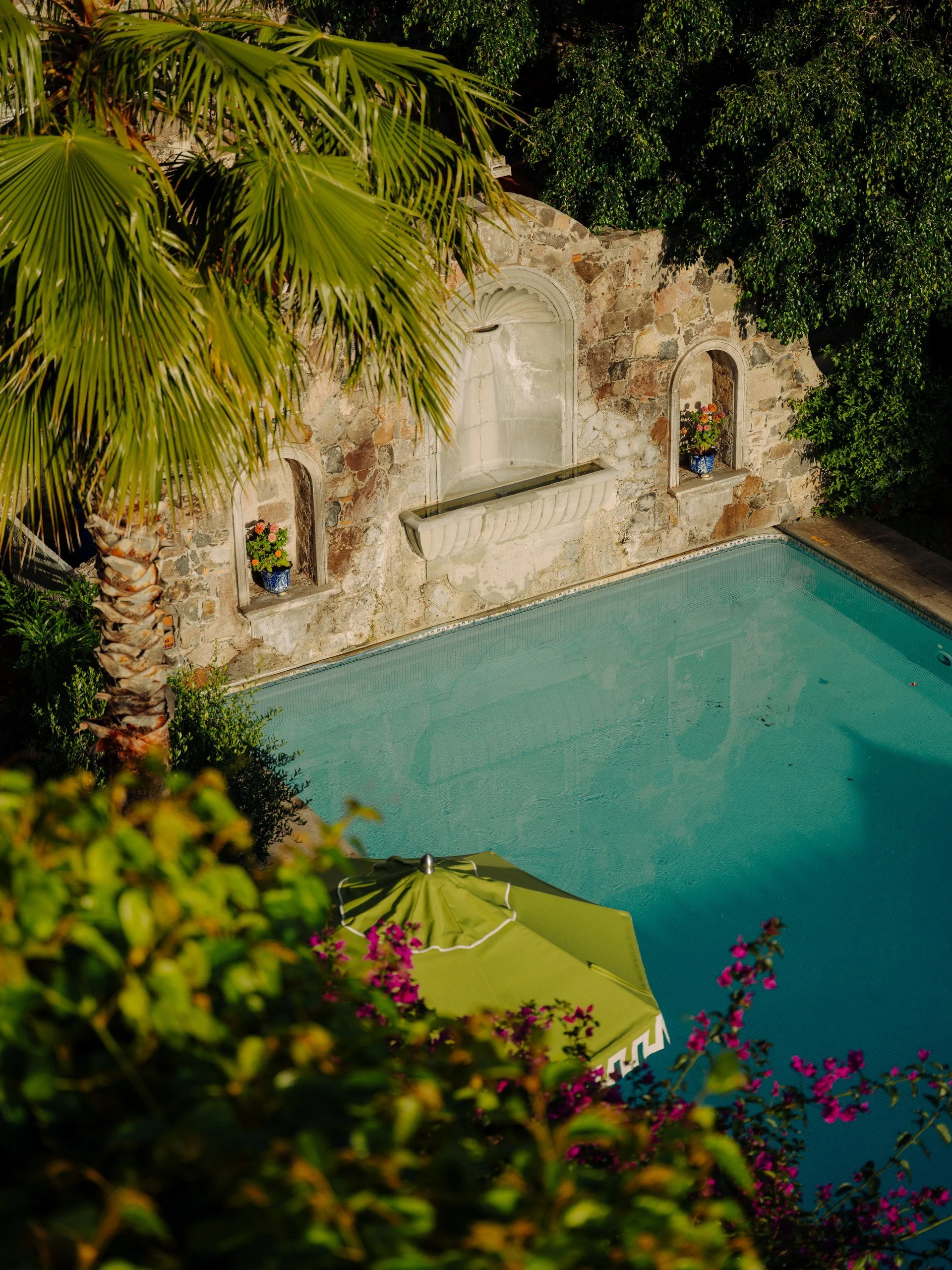 39-hotel-swimming-pool-and-stone-wall-detail.jpg