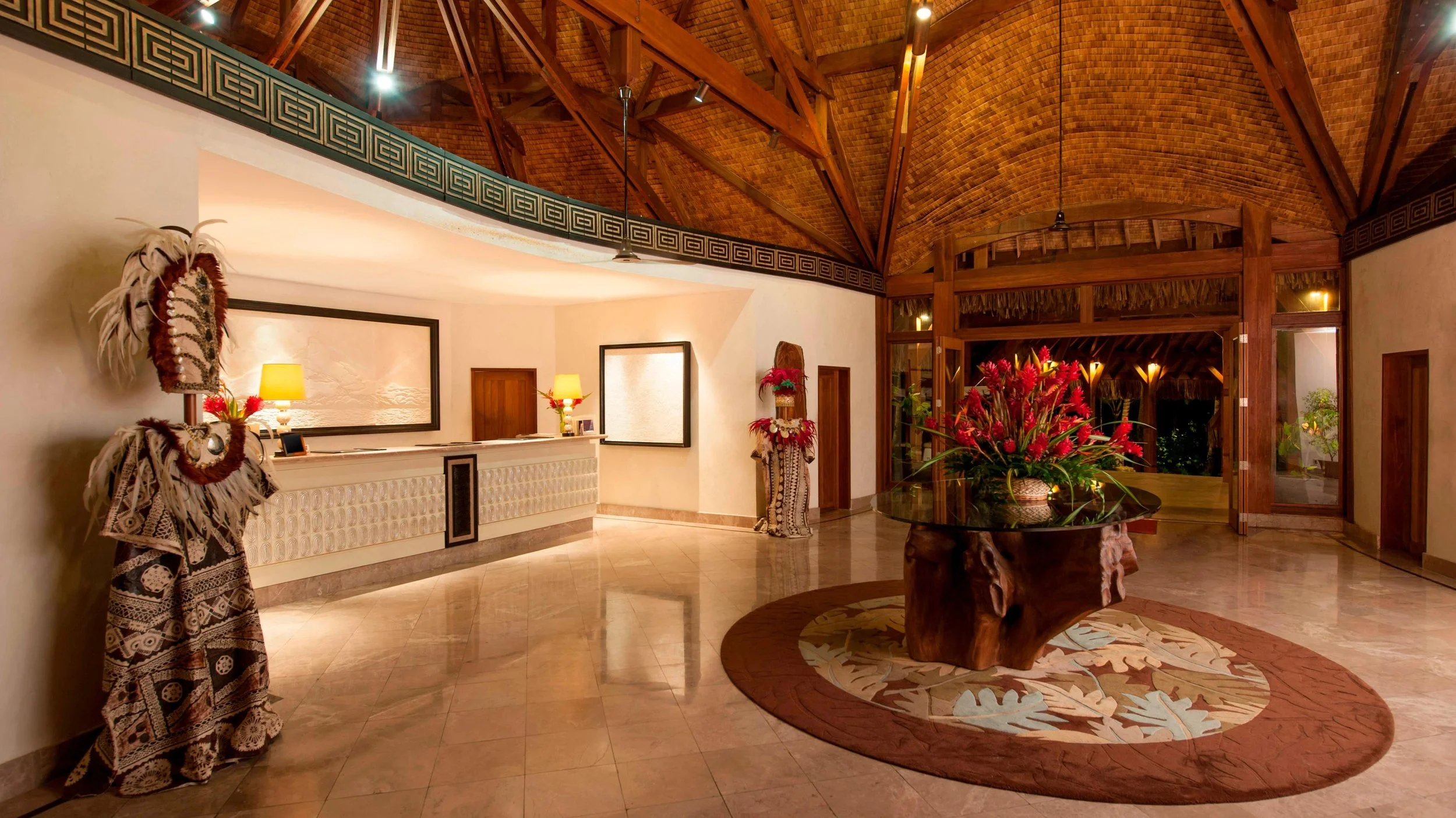 06-St-Regis-Bora-Bora-Lobby-Carved-Figures-and-Timber-Roof.jpg