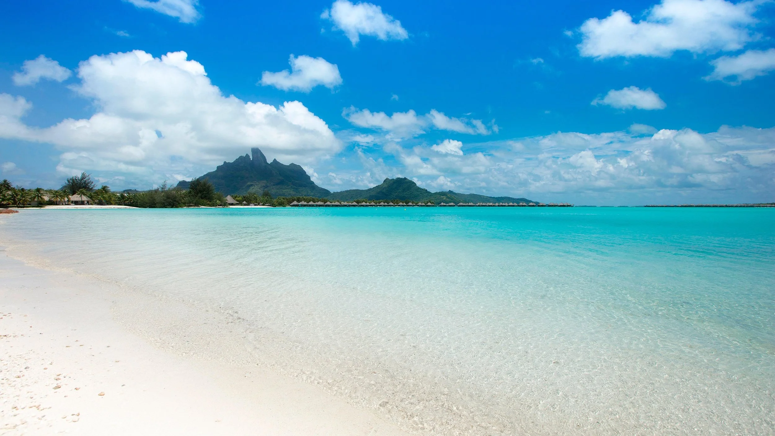 38-St-Regis-Bora-Bora-Resort-Beach-Lagoon-and-Tropical-Sky.jpg