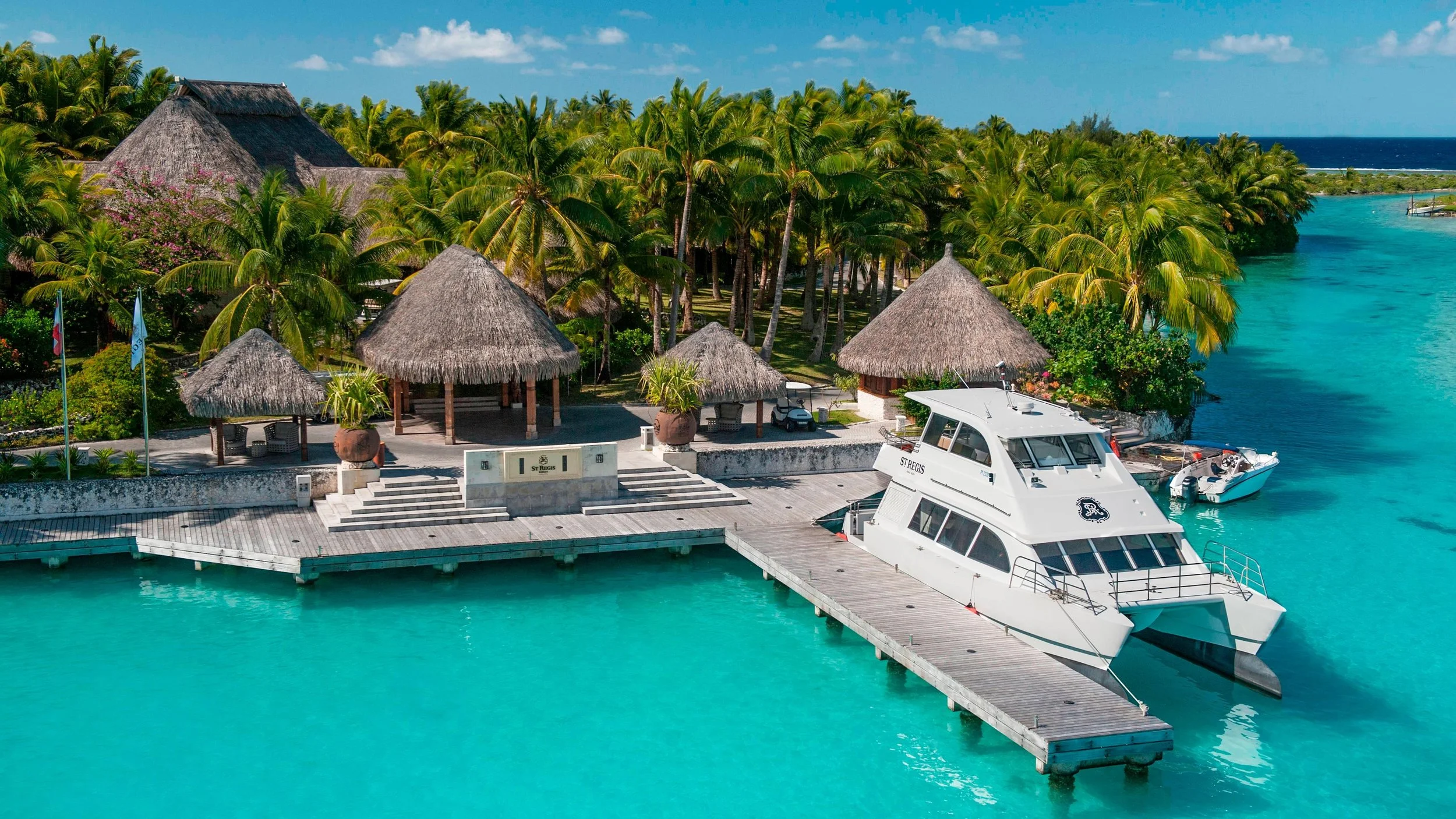 42-St-Regis-Bora-Bora-Arrival-Dock-and-Resort-Boat.jpg