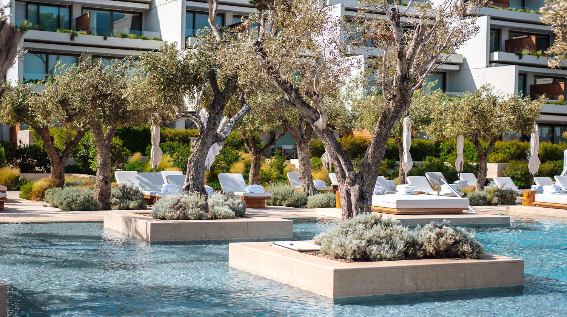 four-seasons-astir-palace-hotel-athens-Nafsika-facade-from-pool.jpg