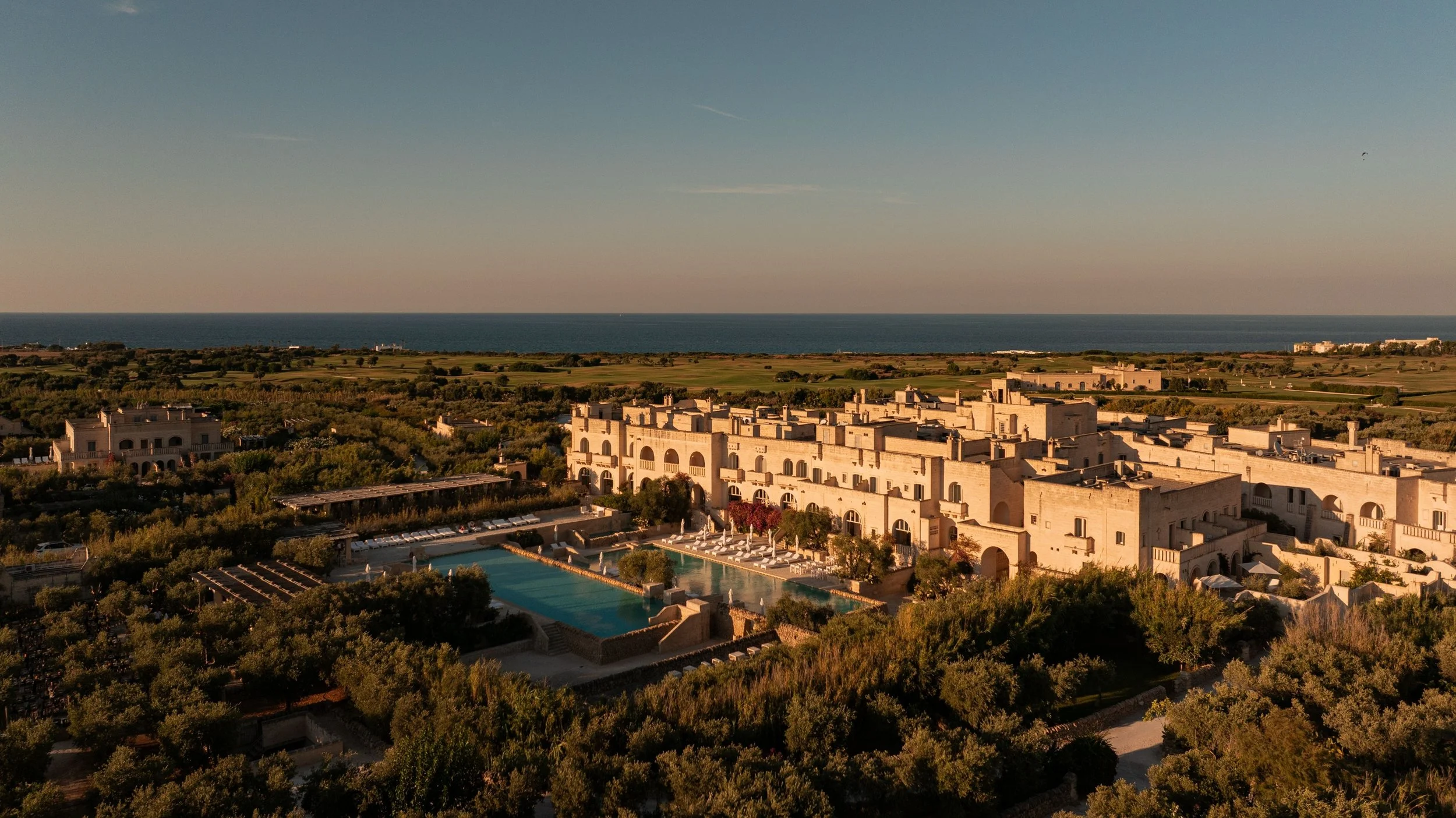 01-Borgo-Egnazia-Main-Building-and-Pools-Aerial.jpg