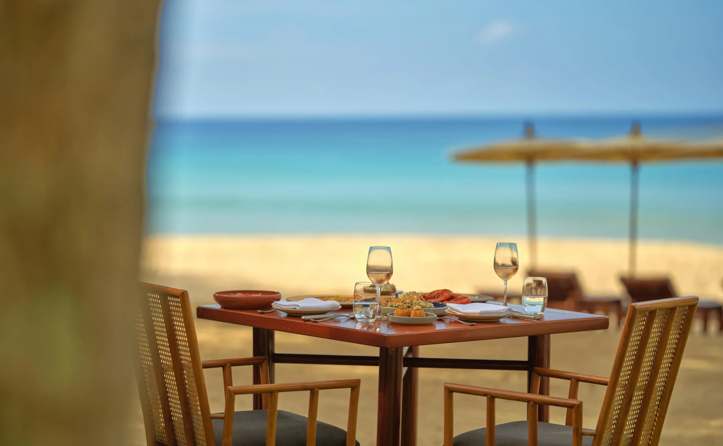 Amanpuri-_Thailand_-_Dining-_Nura-_Table_Setup-_Closeup.webp
