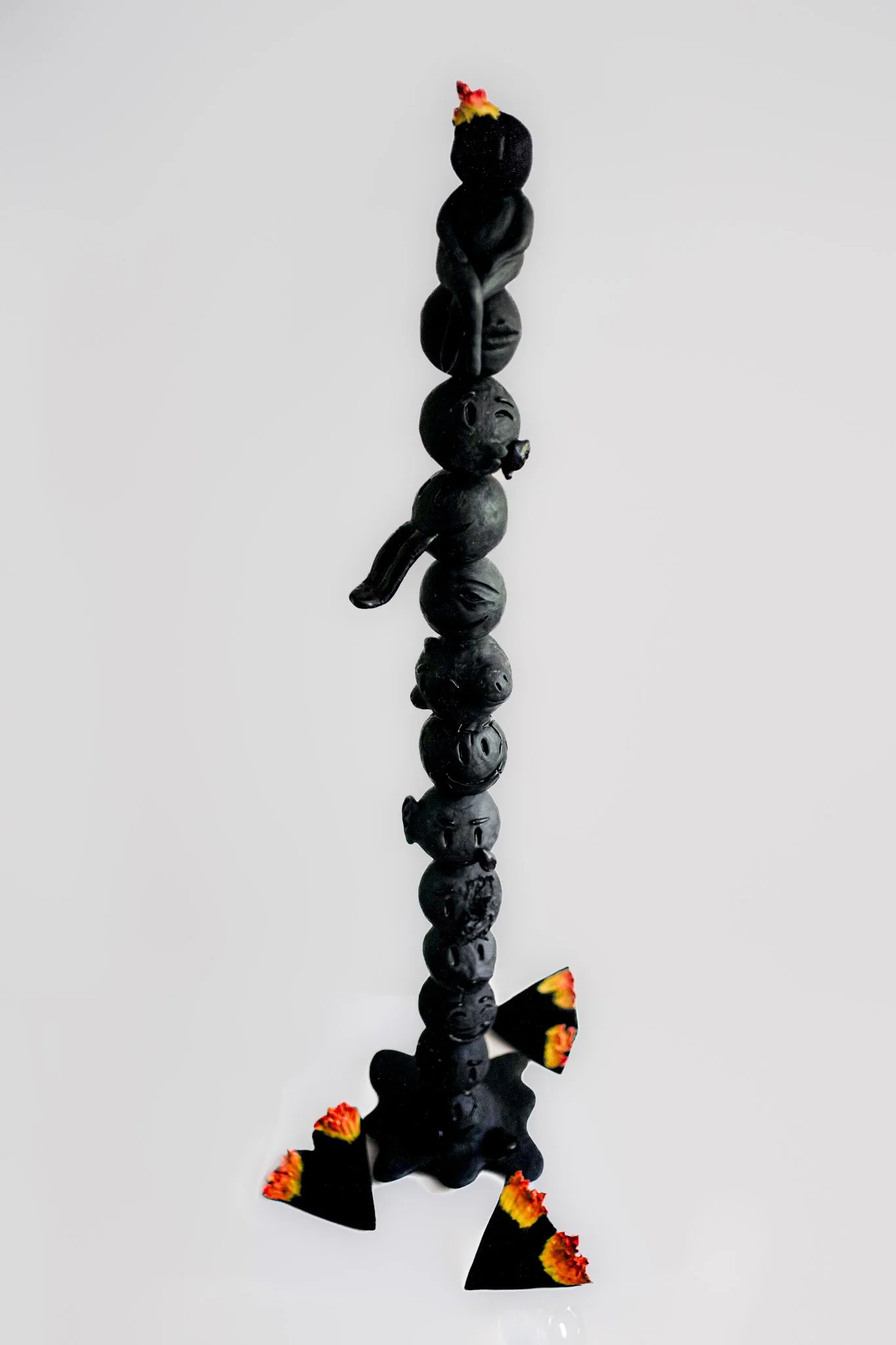 Consumed l Glazed ceramic l 59 x 16 x 16 " - 150 x 40 x 40 cm