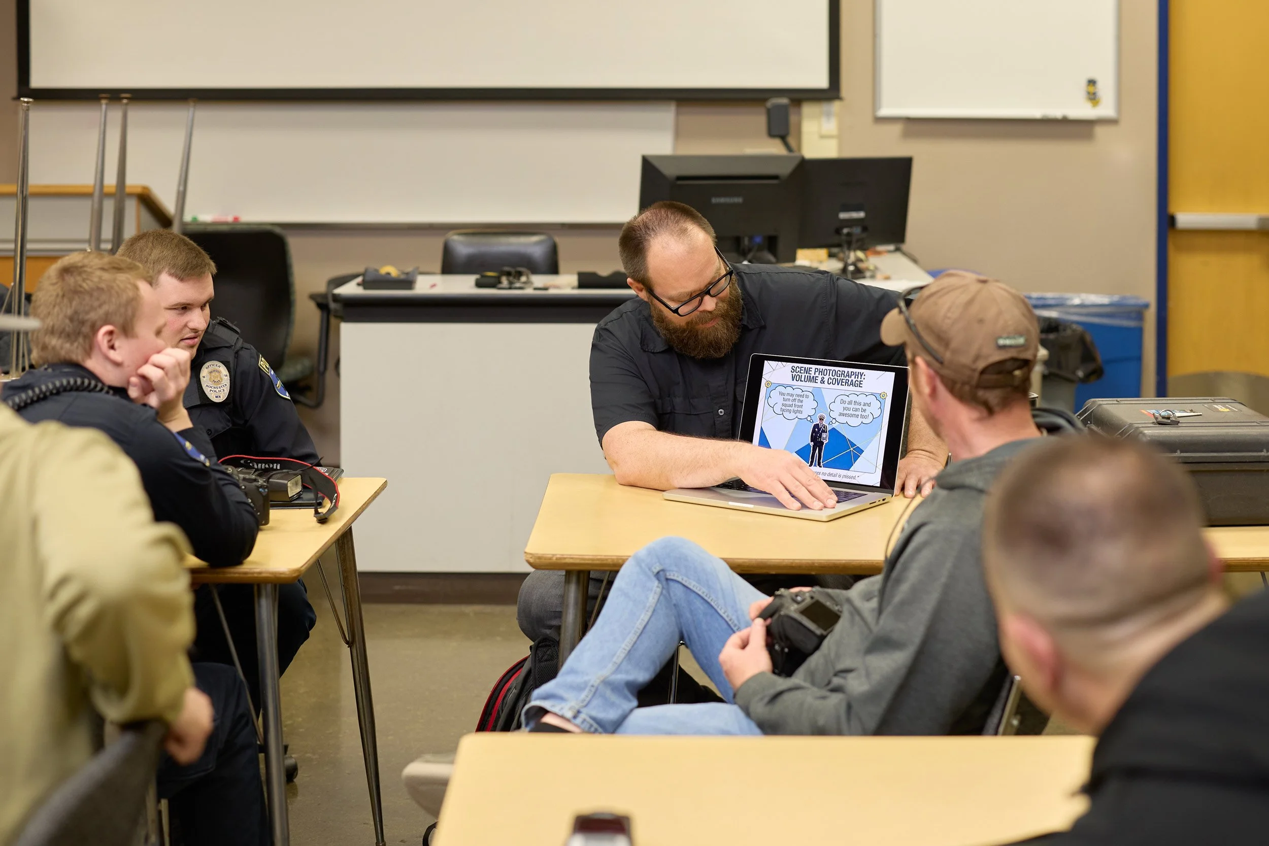 Scott Schoeberl teaching Rochester and Olmsted County officers about volume and coverage in crime scene photography at RCTC