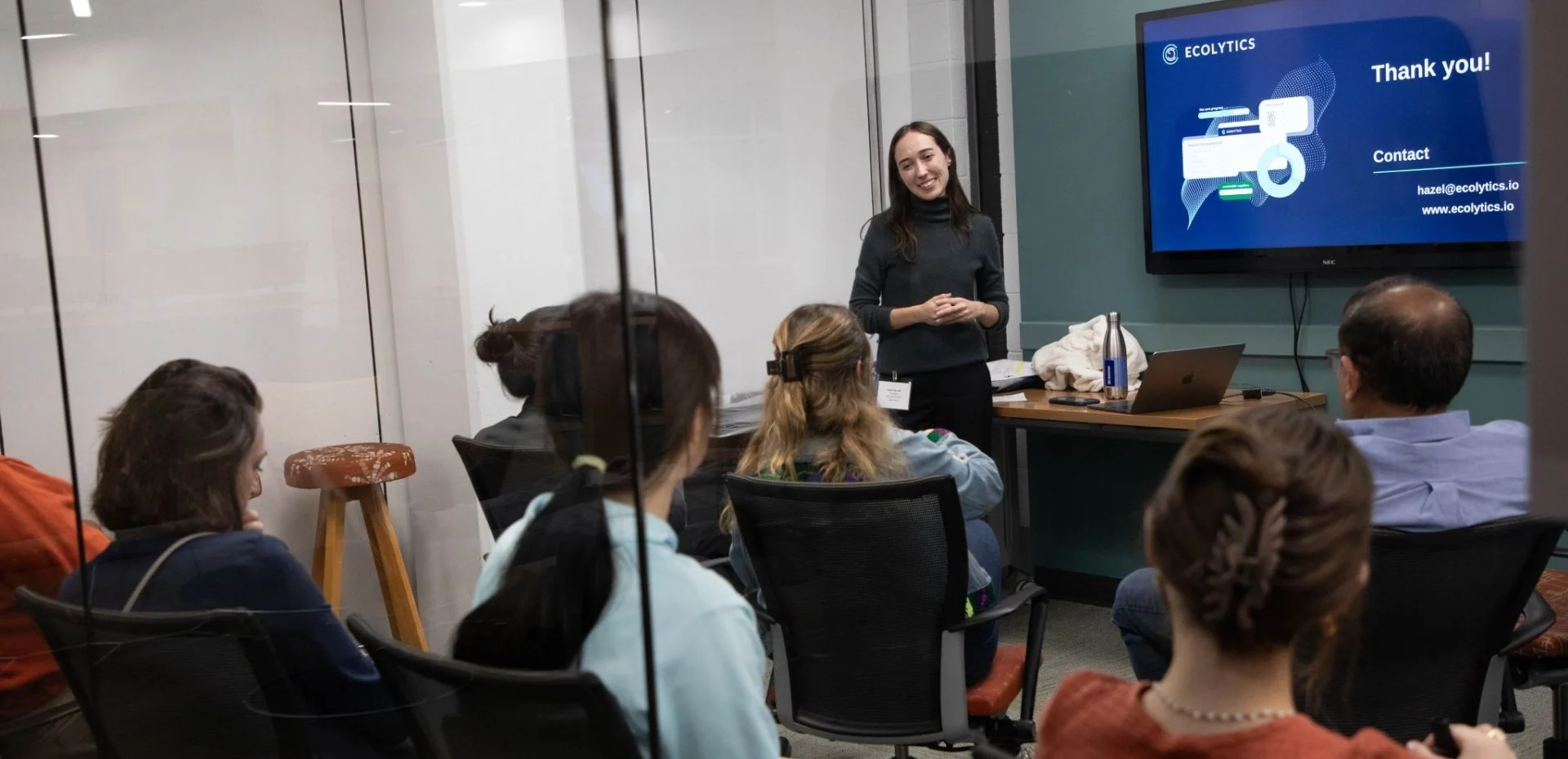 Hazel Horvath standing in front of class of students
