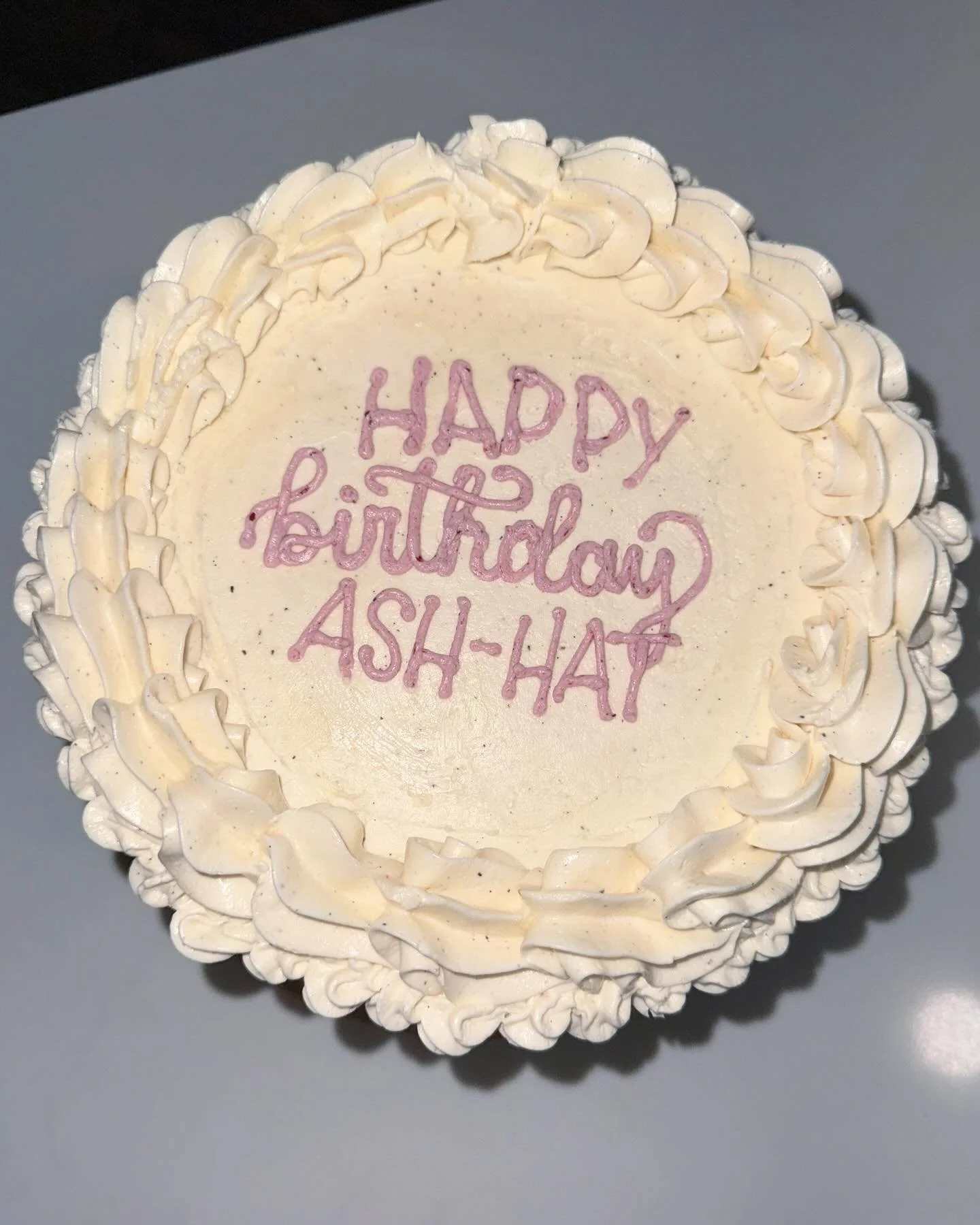Vanilla Bean Cake, filled with Strawberry-Blueberry Jam, covered in Vanilla Bean Buttercream! 😍 // this flavor combo turned out sooooo good. 

The frosting for the writing was made without the use of artificial colors, just the ingredients already b