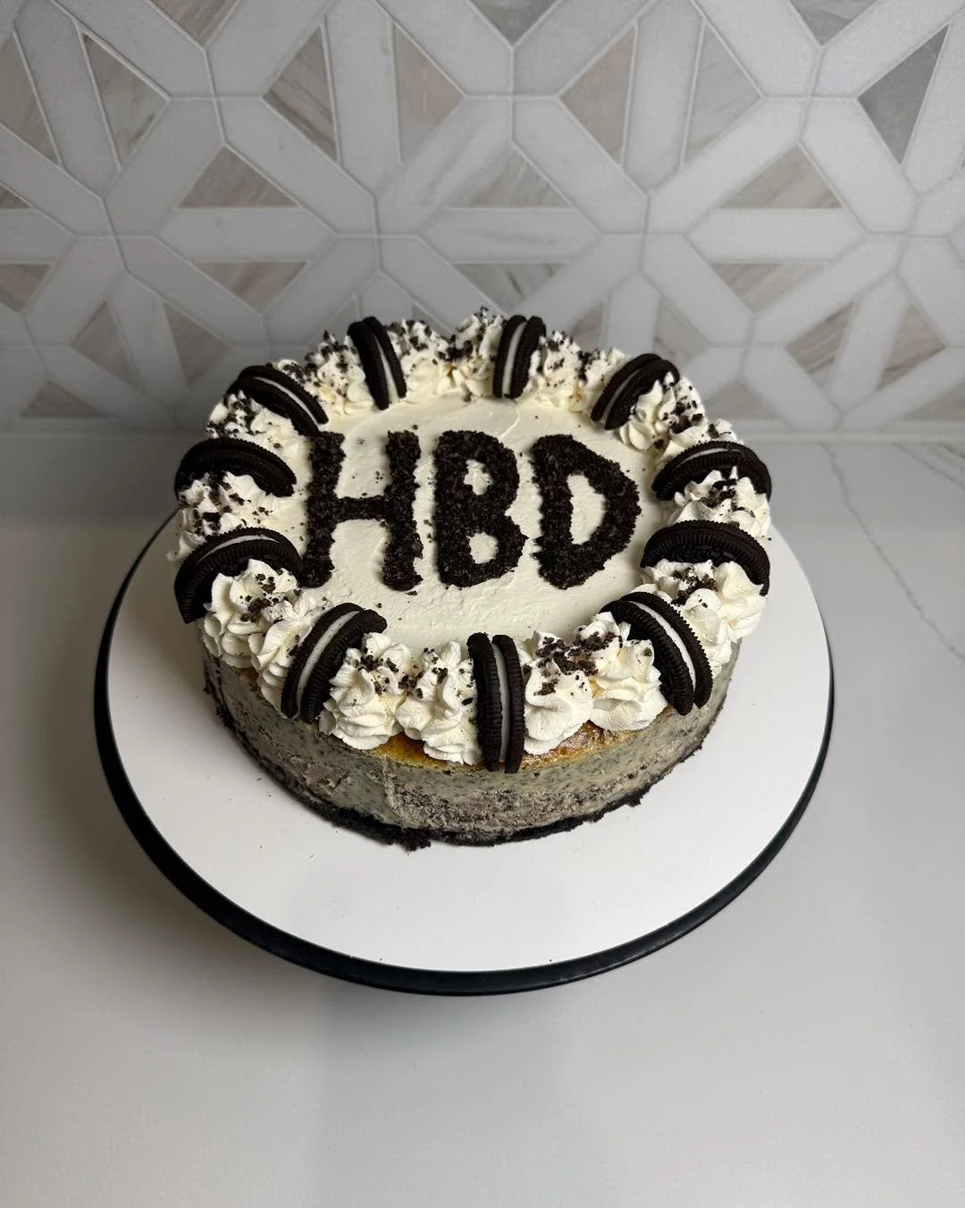 This Cookies &amp; Cream cheesecake is so creamy and melts in your mouth. We love a good, classic flavor around here. 

The topper on this cheesecake was made with dark chocolate and crushed Oreos! 

#baking #bakery #shopjohnsoncounty #joshuatx #john