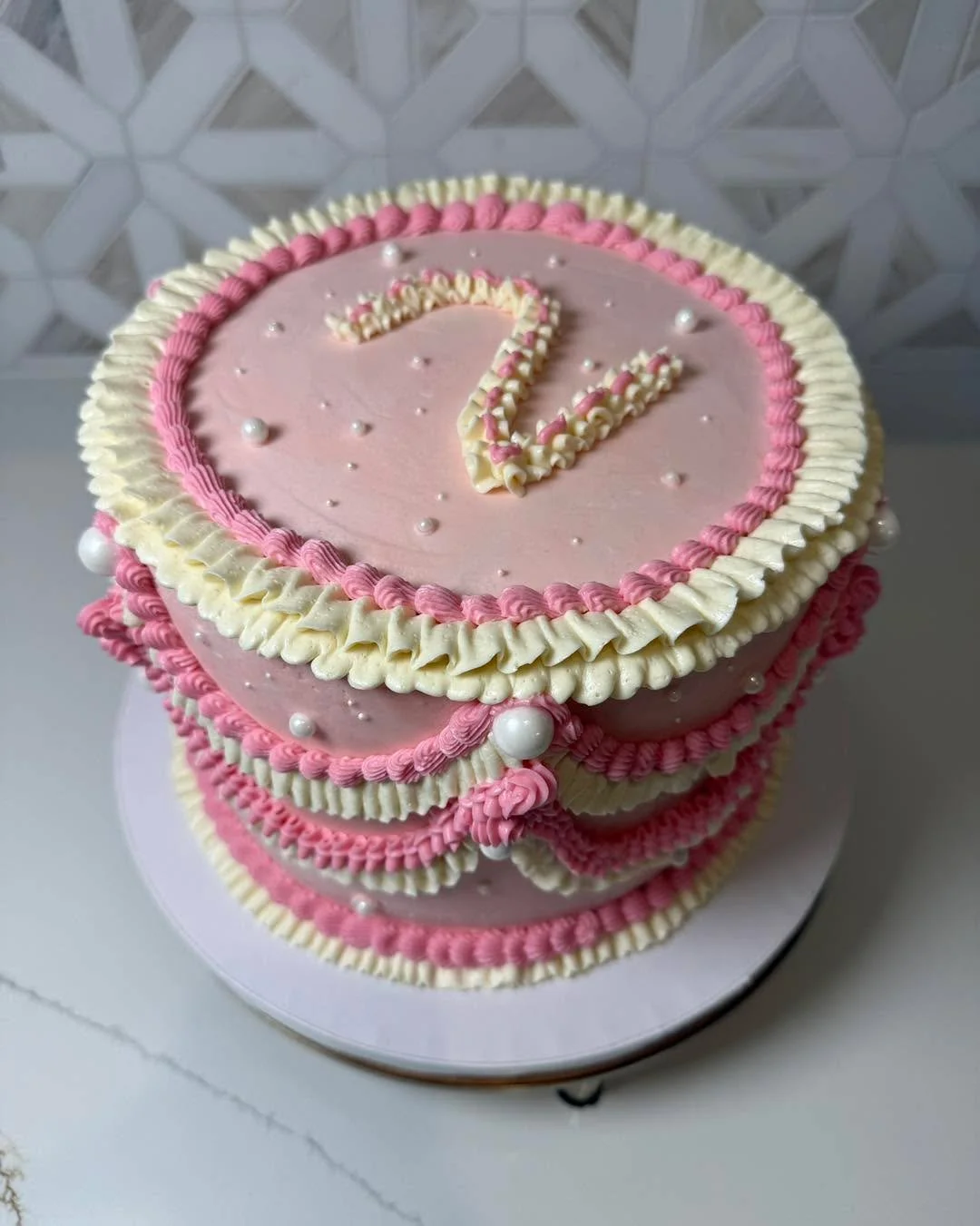 A pink vintage cake was a must-have for a Two Cute birthday party! 

This cake was a dark chocolate cake, filled with a chocolate cookies and cream buttercream, and covered with vanilla buttercream. 

#baking #bakery #shopjohnsoncounty #joshuatx #joh