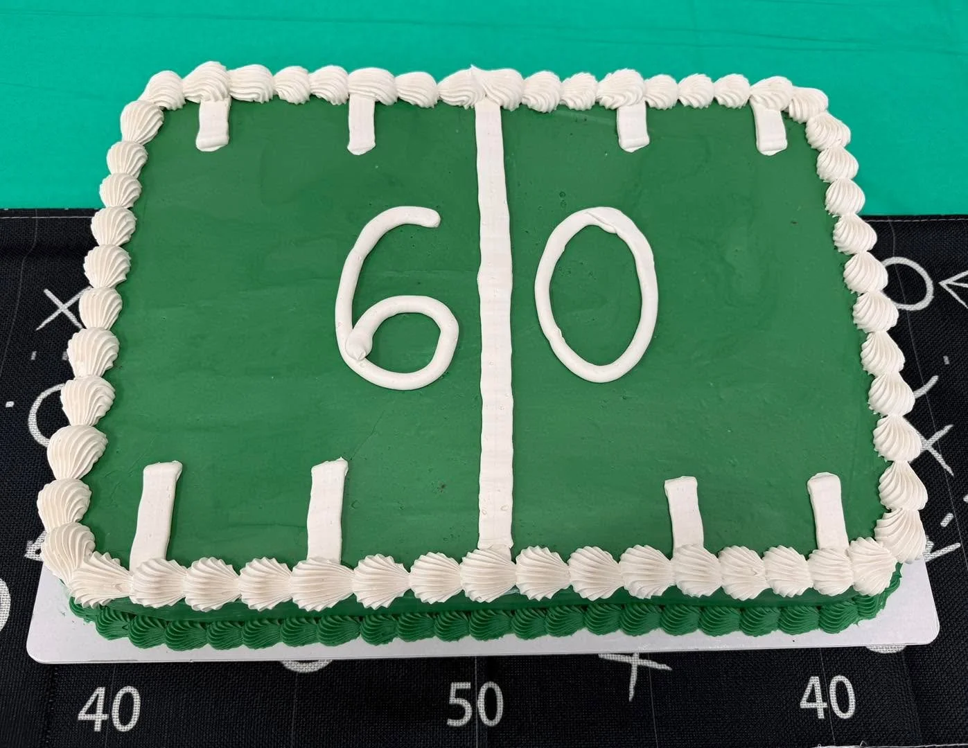 A cake for &ldquo;Reaching the 60 yard line&rdquo; // This cake is a dark chocolate cake filled with a pecan cream pie filling and covered with vanilla buttercream. 

This new filling as well as a coconut cream pie filling and a chocolate cream pie f