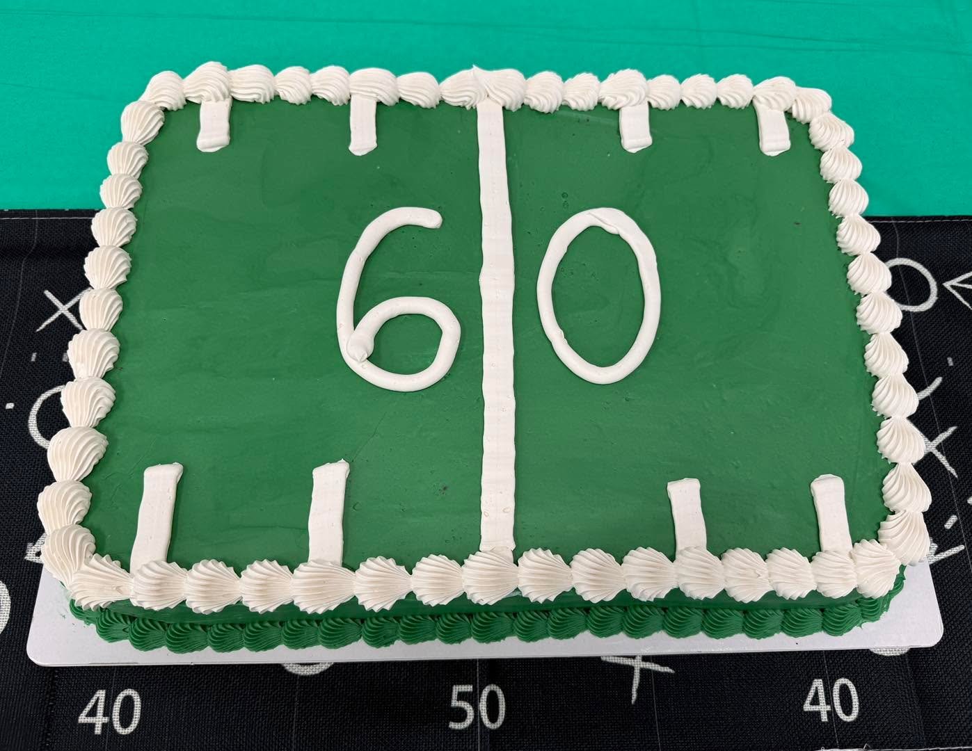 A cake for &ldquo;Reaching the 60 yard line&rdquo; // This cake is a dark chocolate cake filled with a pecan cream pie filling and covered with vanilla buttercream. 

This new filling as well as a coconut cream pie filling and a chocolate cream pie f