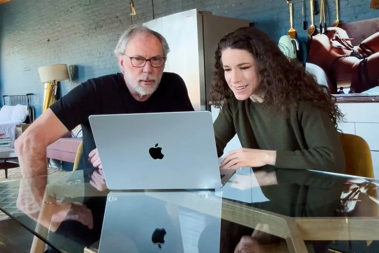 Photographer and client looking at photos during the pre-session planning meeting.