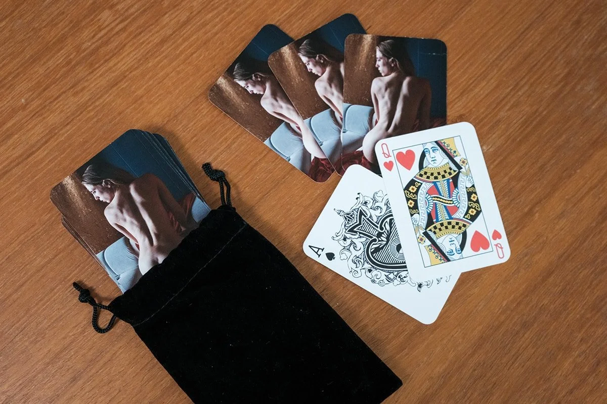 Deck of playing cards with a boudoir photo on the card backs.