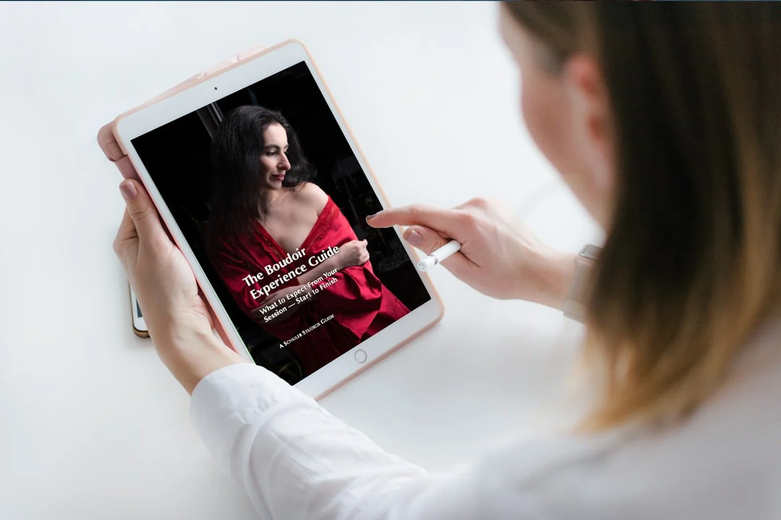 Over the shoulder view of a downloaded guide on a tablet