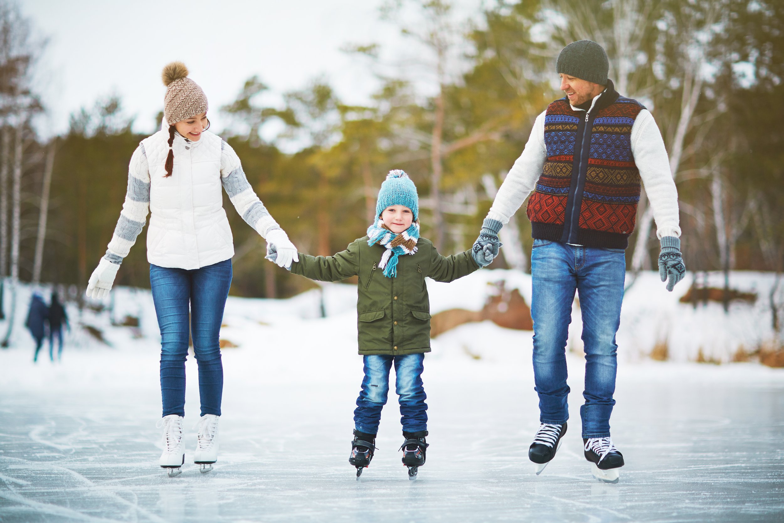 A family skates together.
