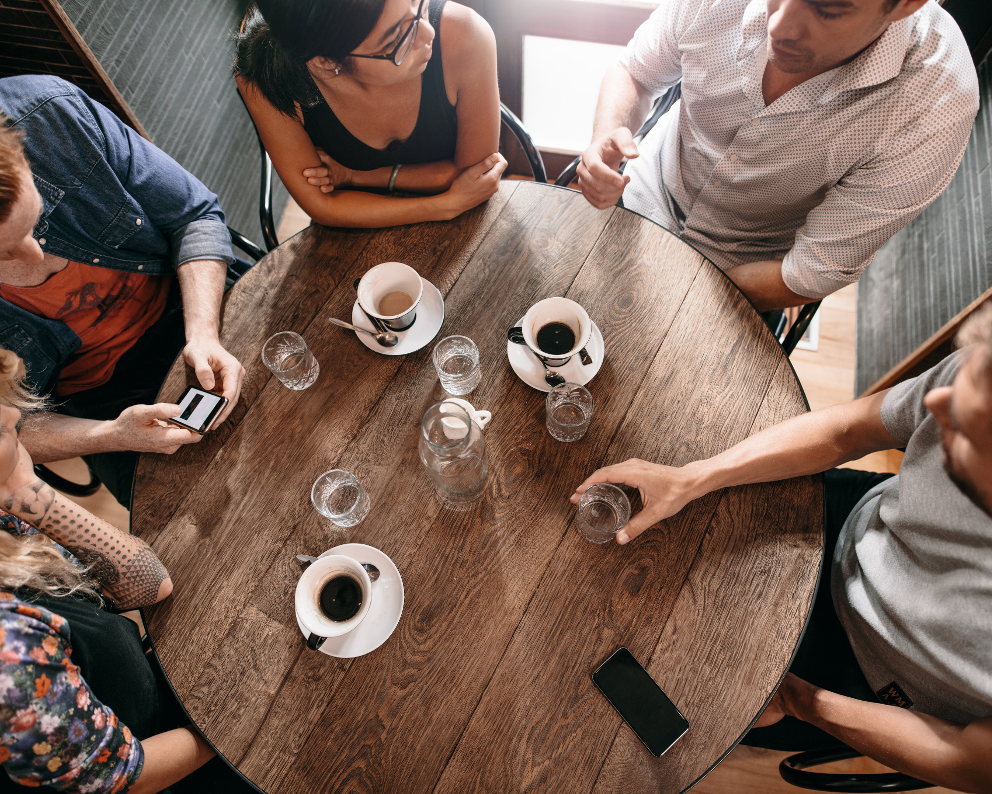People drinking coffee and talking.