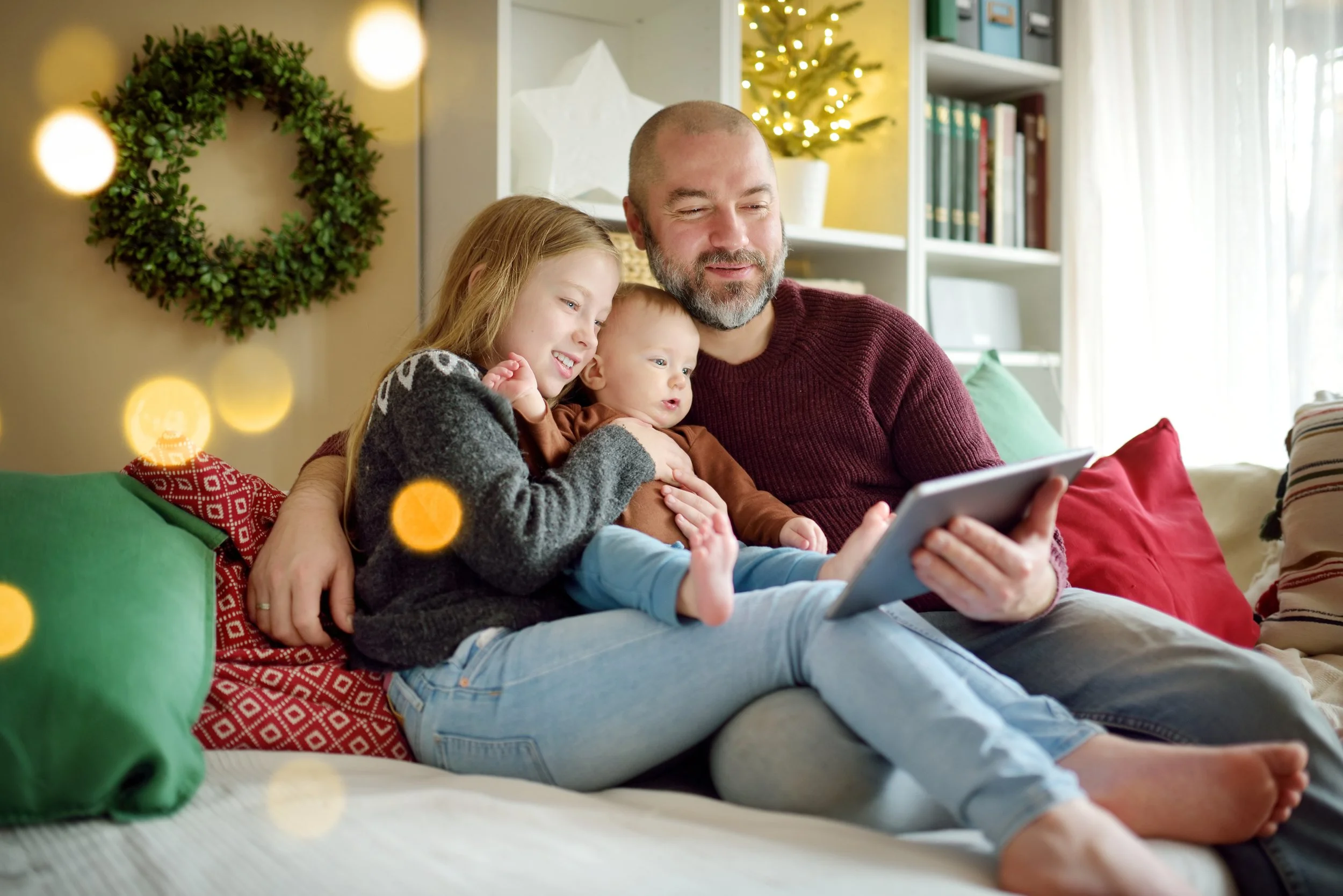A family reads together during Christmas.