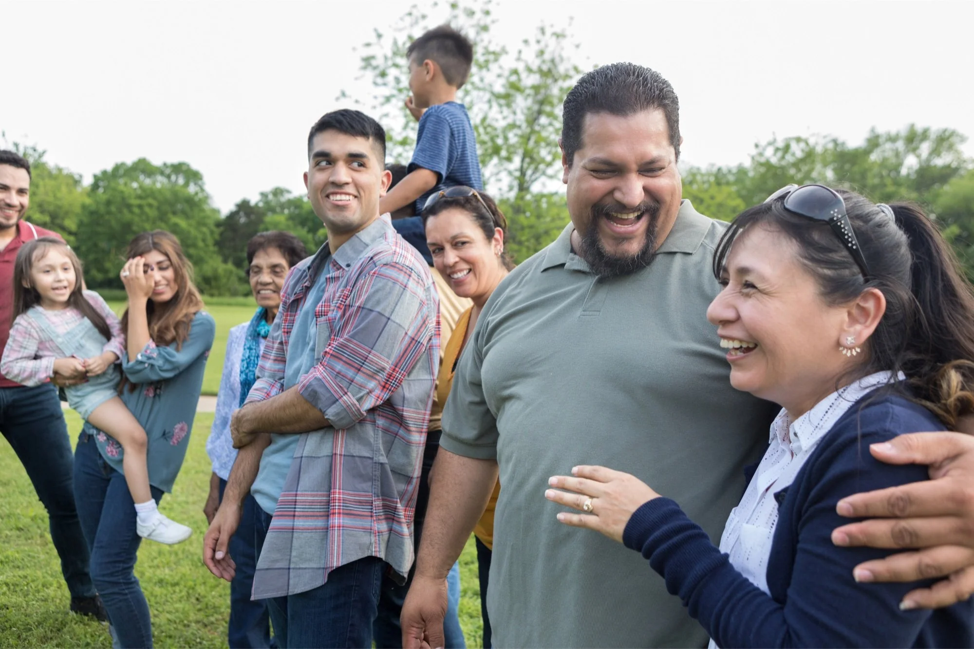 A family hanging out and enjoying the outside.