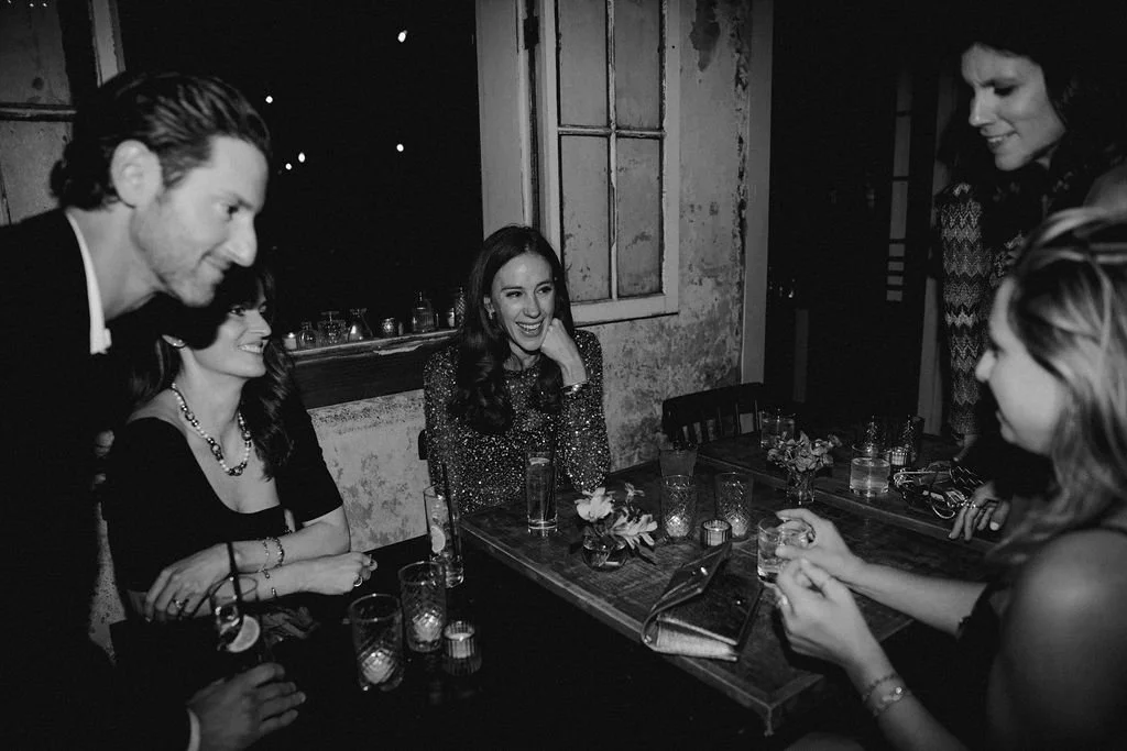 group of people laughing and talking