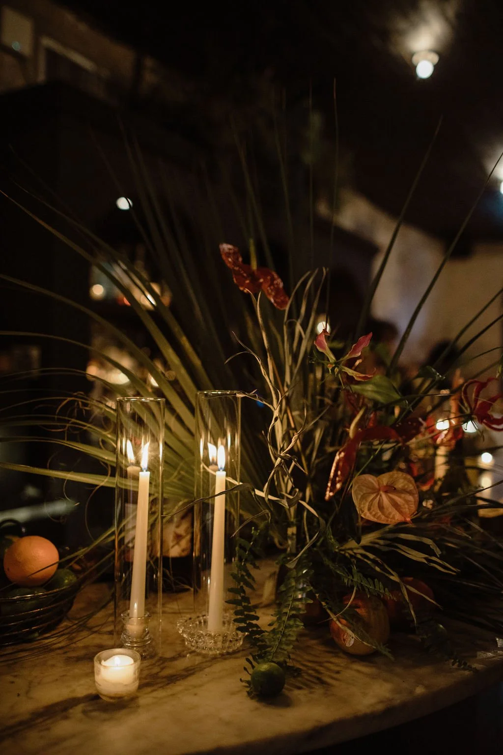 candles and florals on the bar