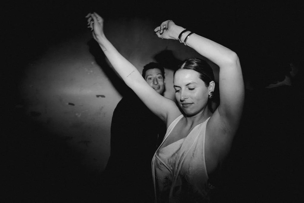 woman waving her hands in the air