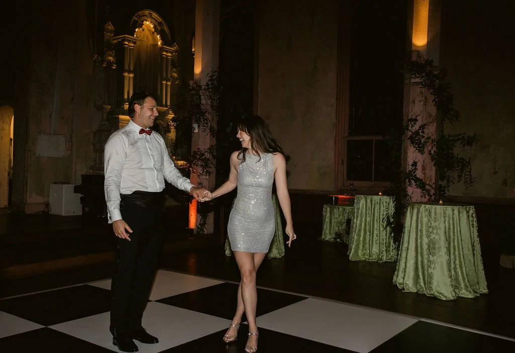 bride and groom on the dance floor bride wearing a silver sparkle dress