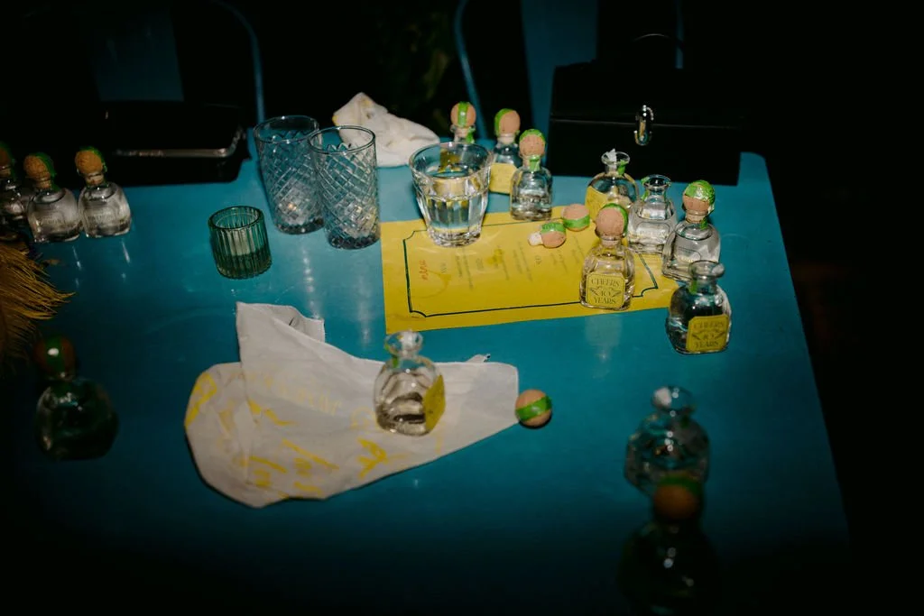 tequila shots on a blue table