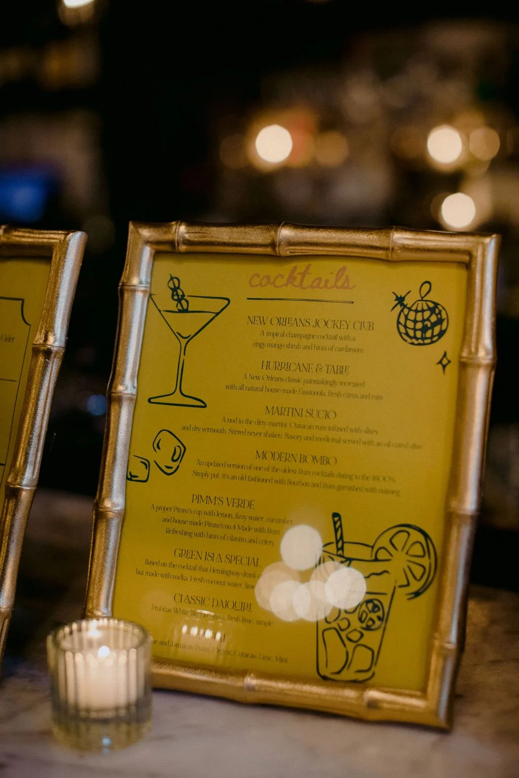 cocktail menu in a gold frame
