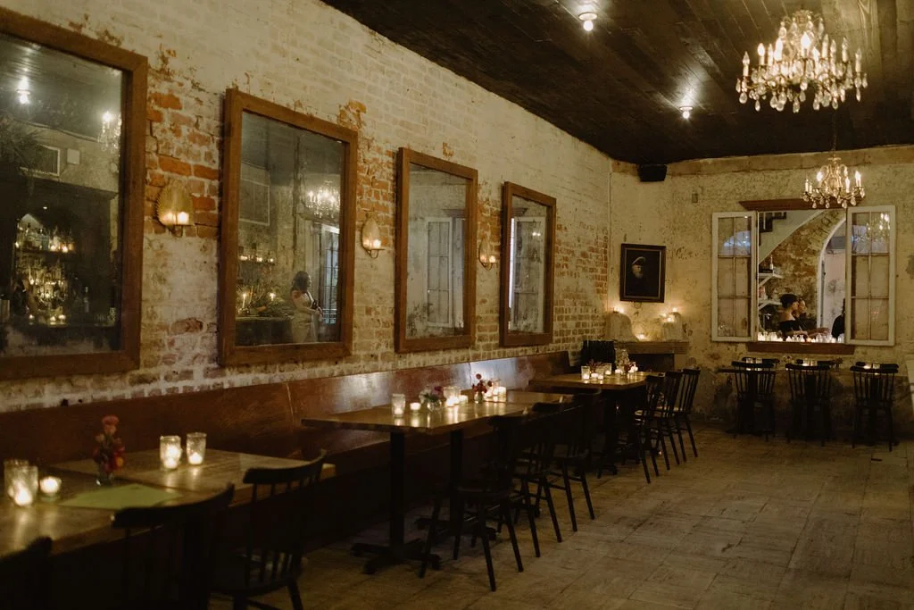 Dining Tables with candles at Cane & Table