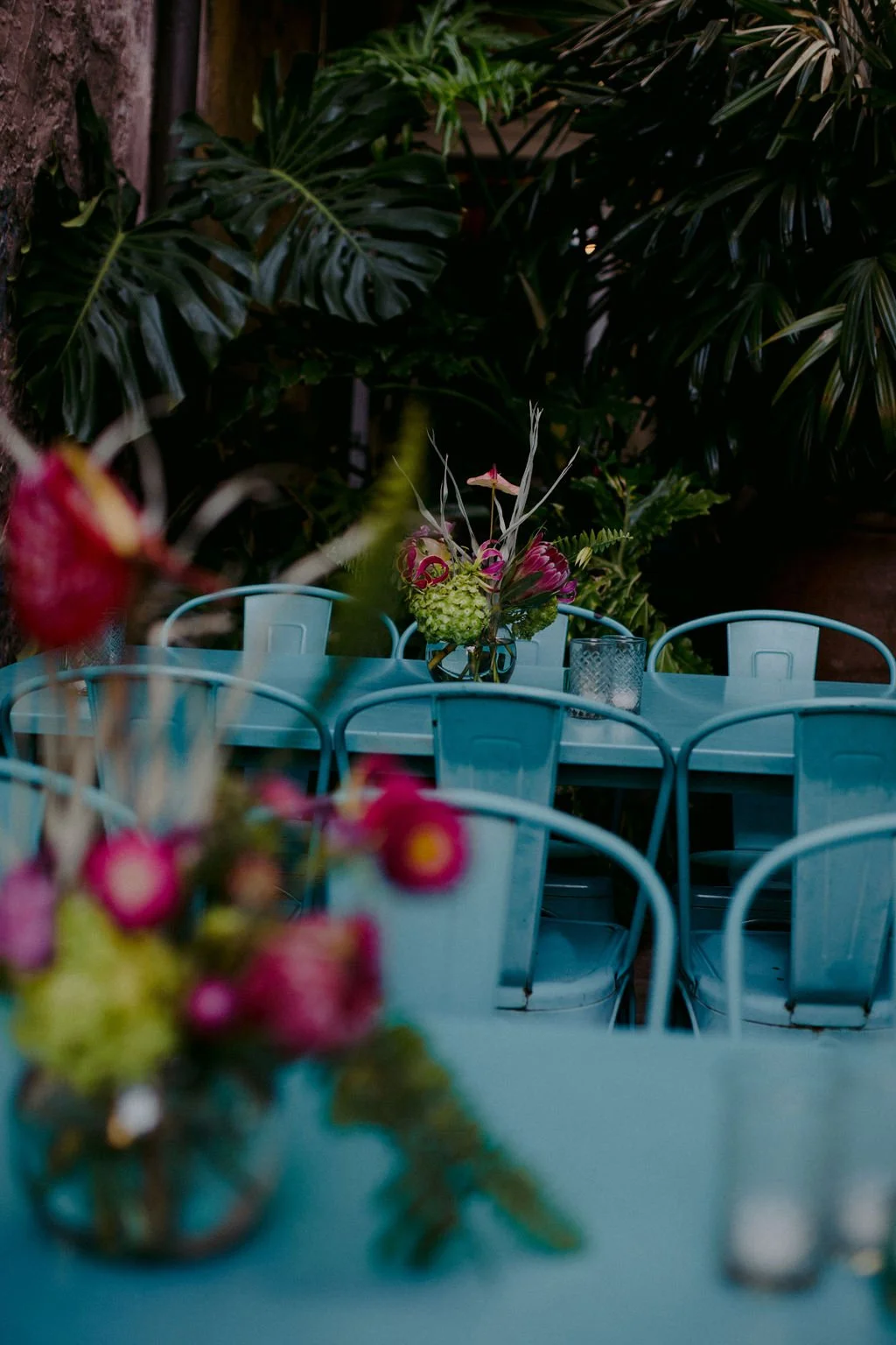 Floral vases on blue tables