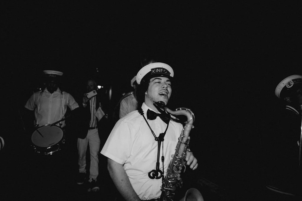 band memebr singing with a trombone