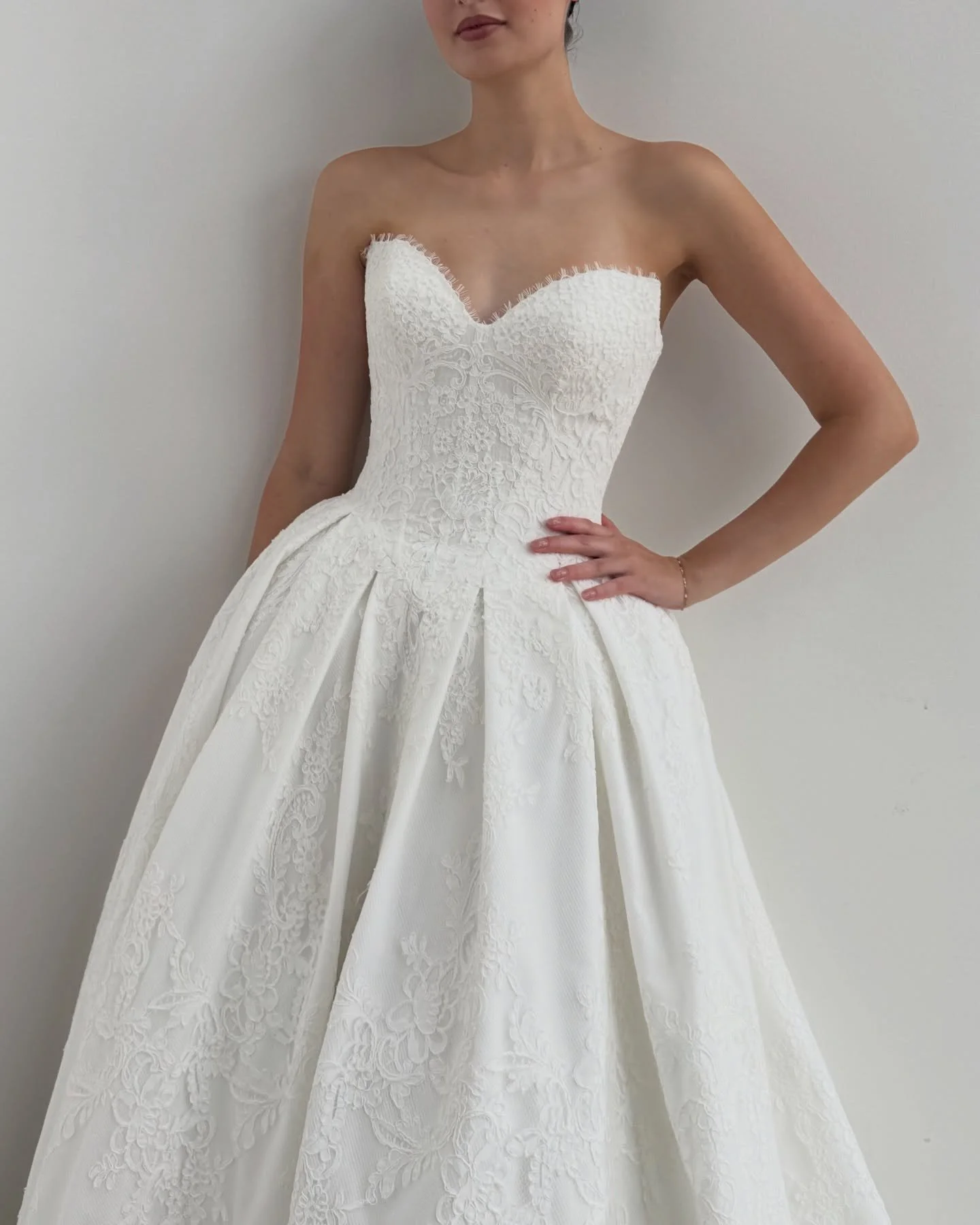 Our take on a classic ballgown 💫 

Crafted in corded lace, SAPPHIRE is a basque waist beauty featuring box pleats surrounding the skirt and delicate eyelash lace along its sweetheart neckline 🩰