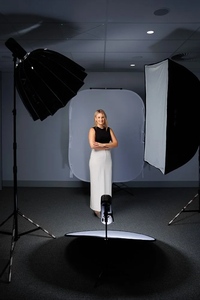 Mobile studio set up in a Brisbane office boardroom for team headshots.