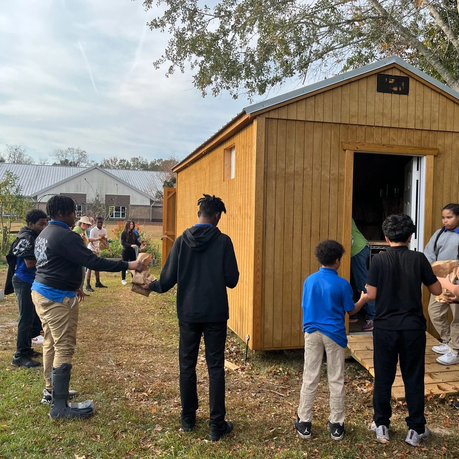 How do you get 140 bags of sweet potatoes into the school for distribution? Team Work! Good job student gardeners! Growing and Working Together! #heritagecommunityfarm #WBMS