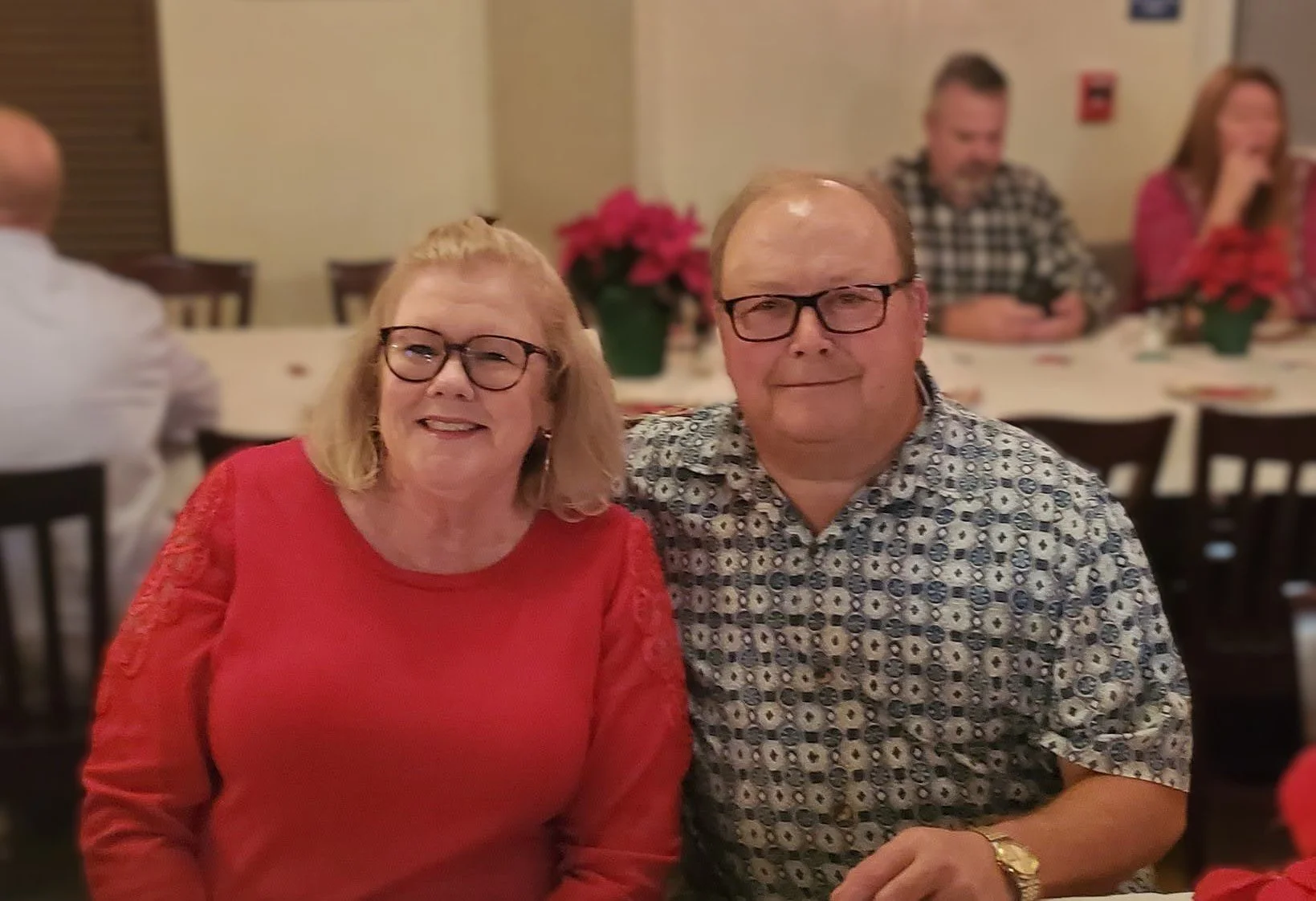 couple smiling at a holiday party