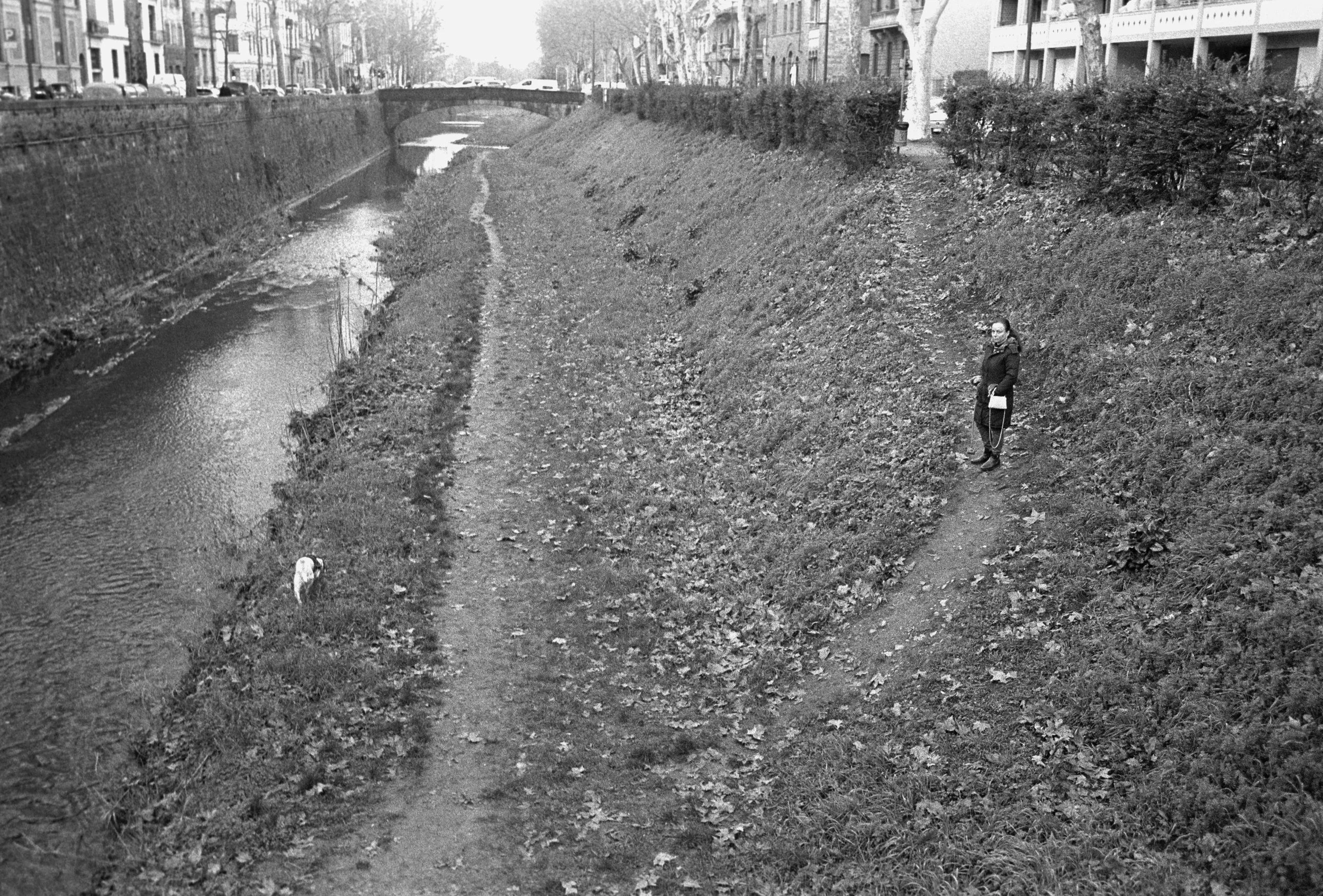 Woman walking her dog.