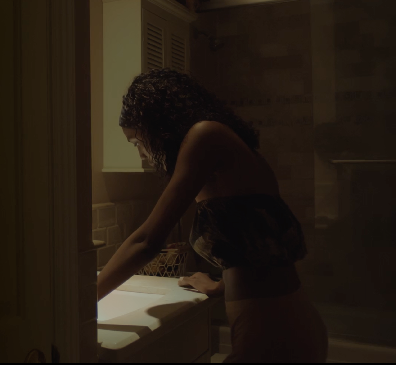 Late Fall: Kemi wears a long beige skirt and black bandeau