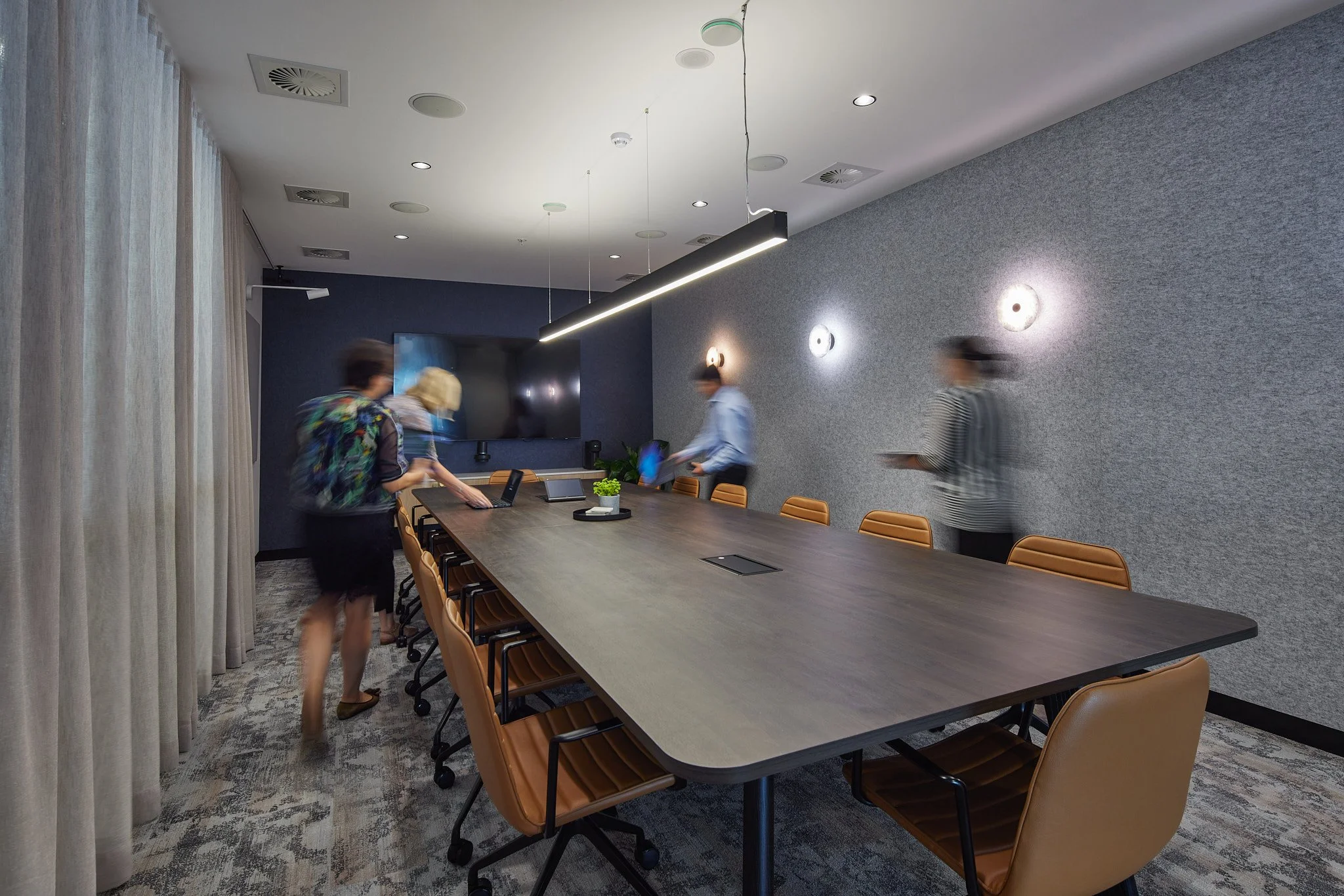 Main meeting room fit with a tv and sophisticated lighting
