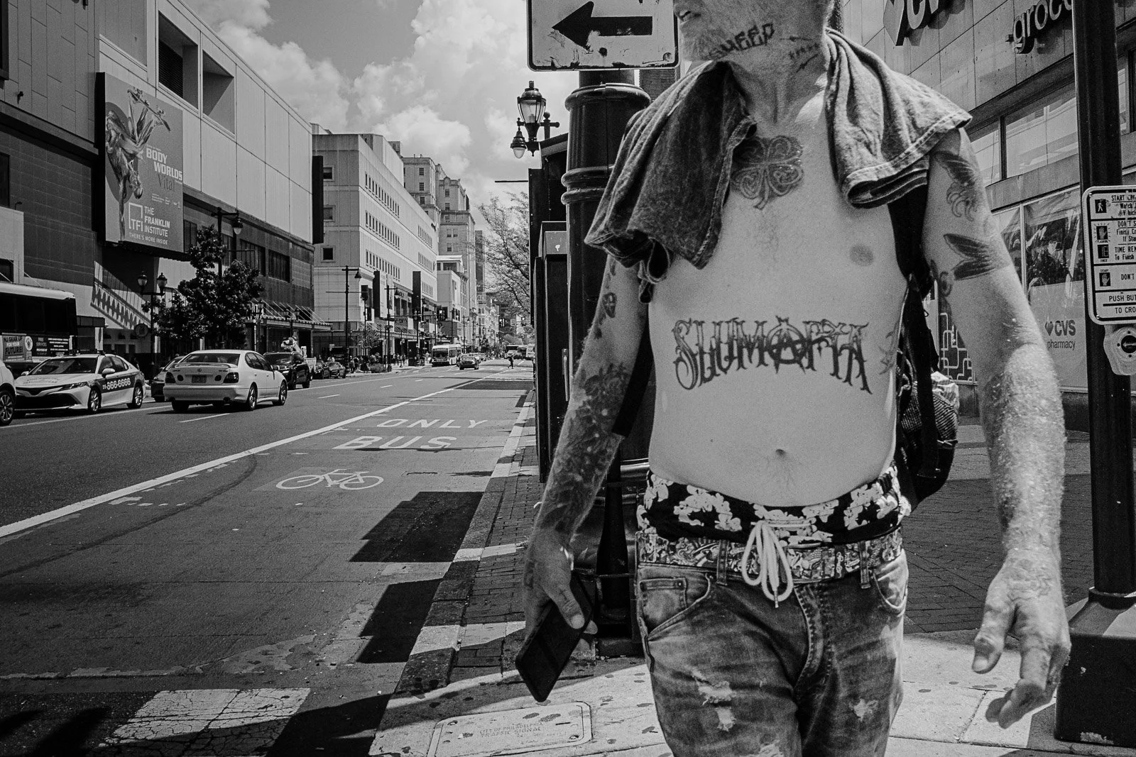 Shirtless man on Market in Philly, 2025 