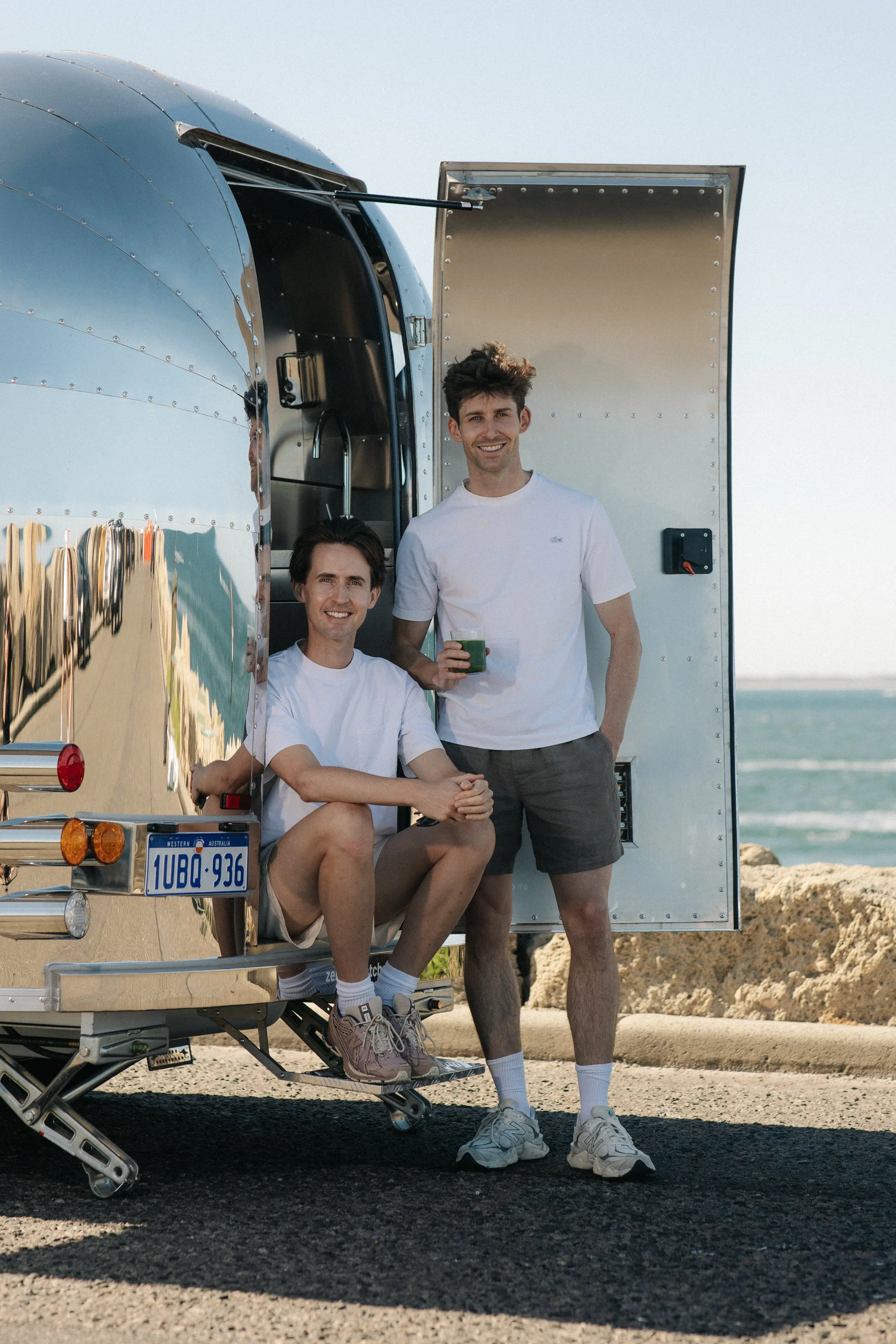 Image of Calum and Liam the founders of Zenergi Matcha at the back of the travelling matcha house