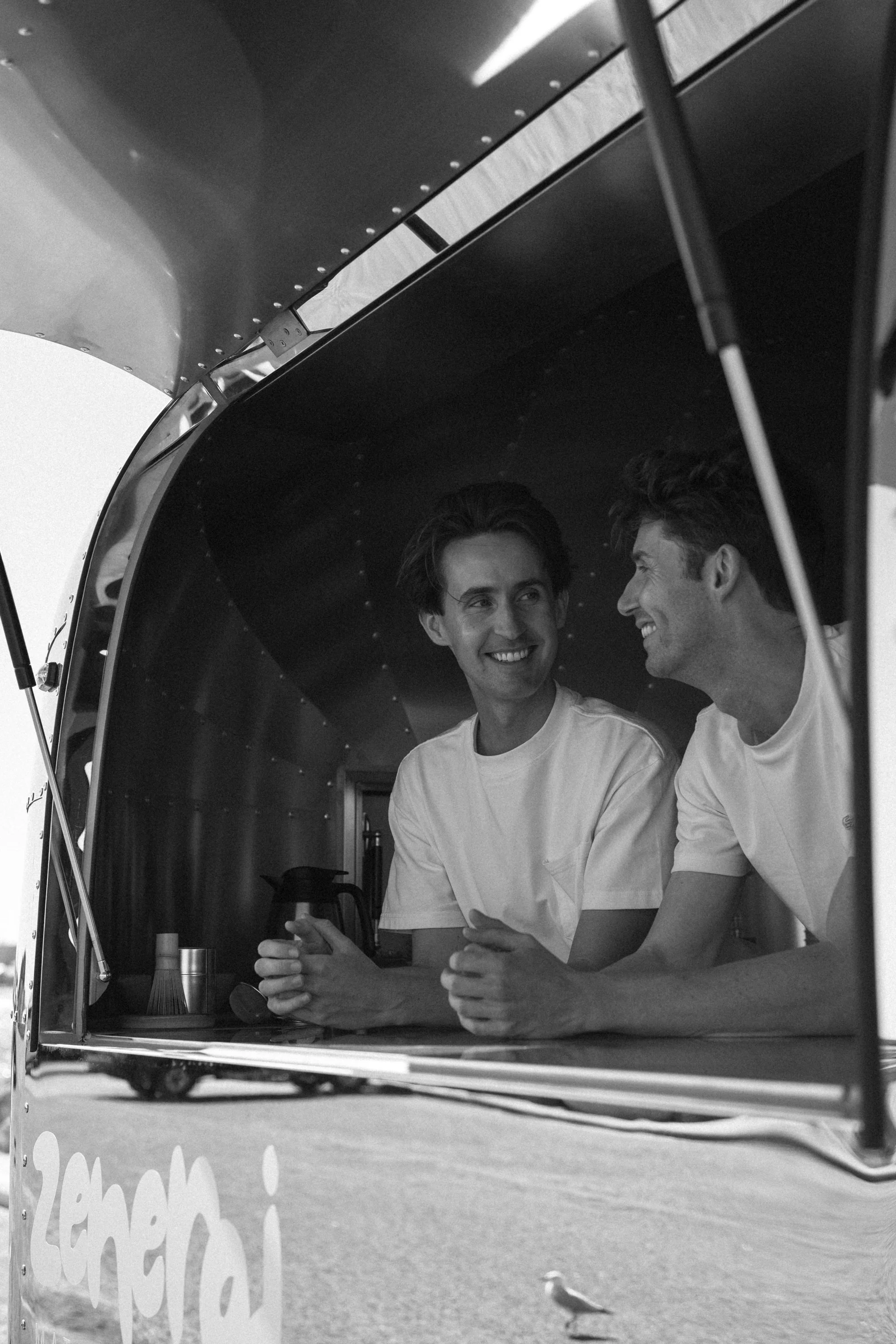Calum and Liam the founders of Zenergi matcha in the travelling matcha house window