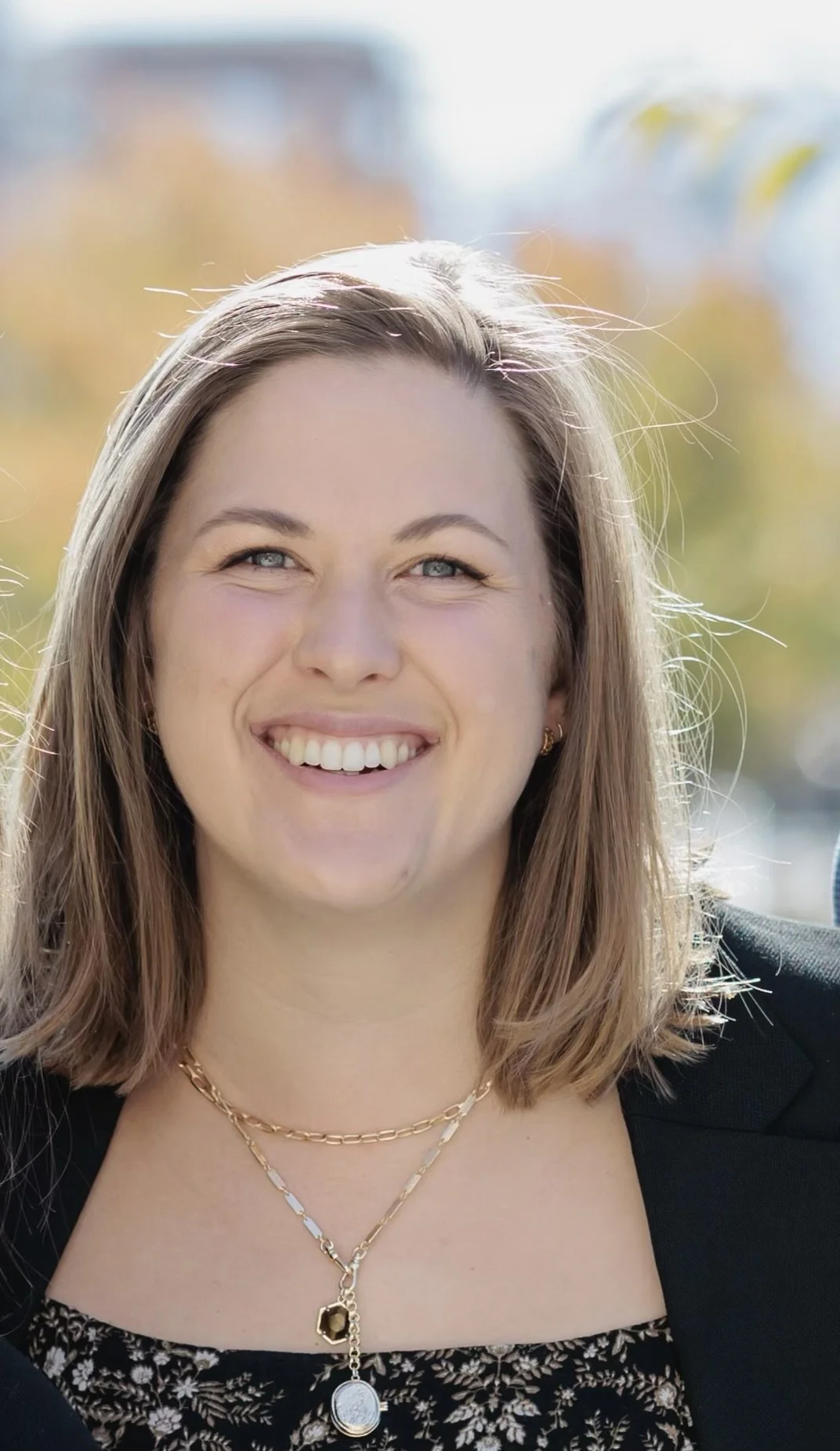 Image of Amy Lambert showing her head and shoulders with a blurred background