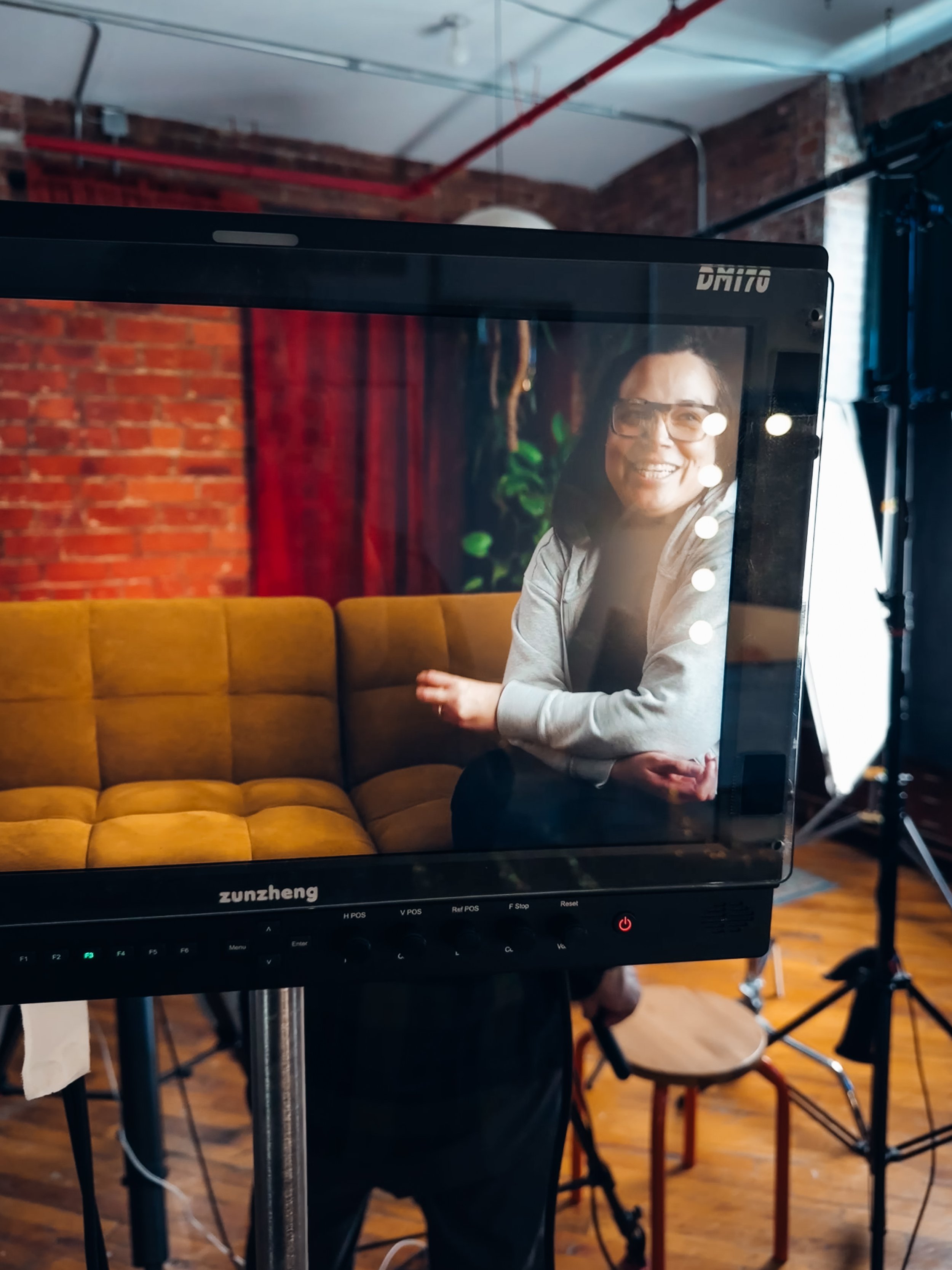  Director Pamela Ralat through the monitor on location in Brooklyn.  