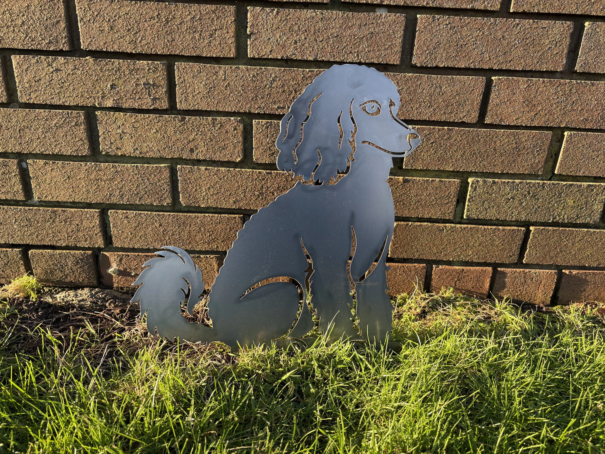 Steel sitting poodle garden art ornament handcrafted with care, making a thoughtful gift for poodle lovers.