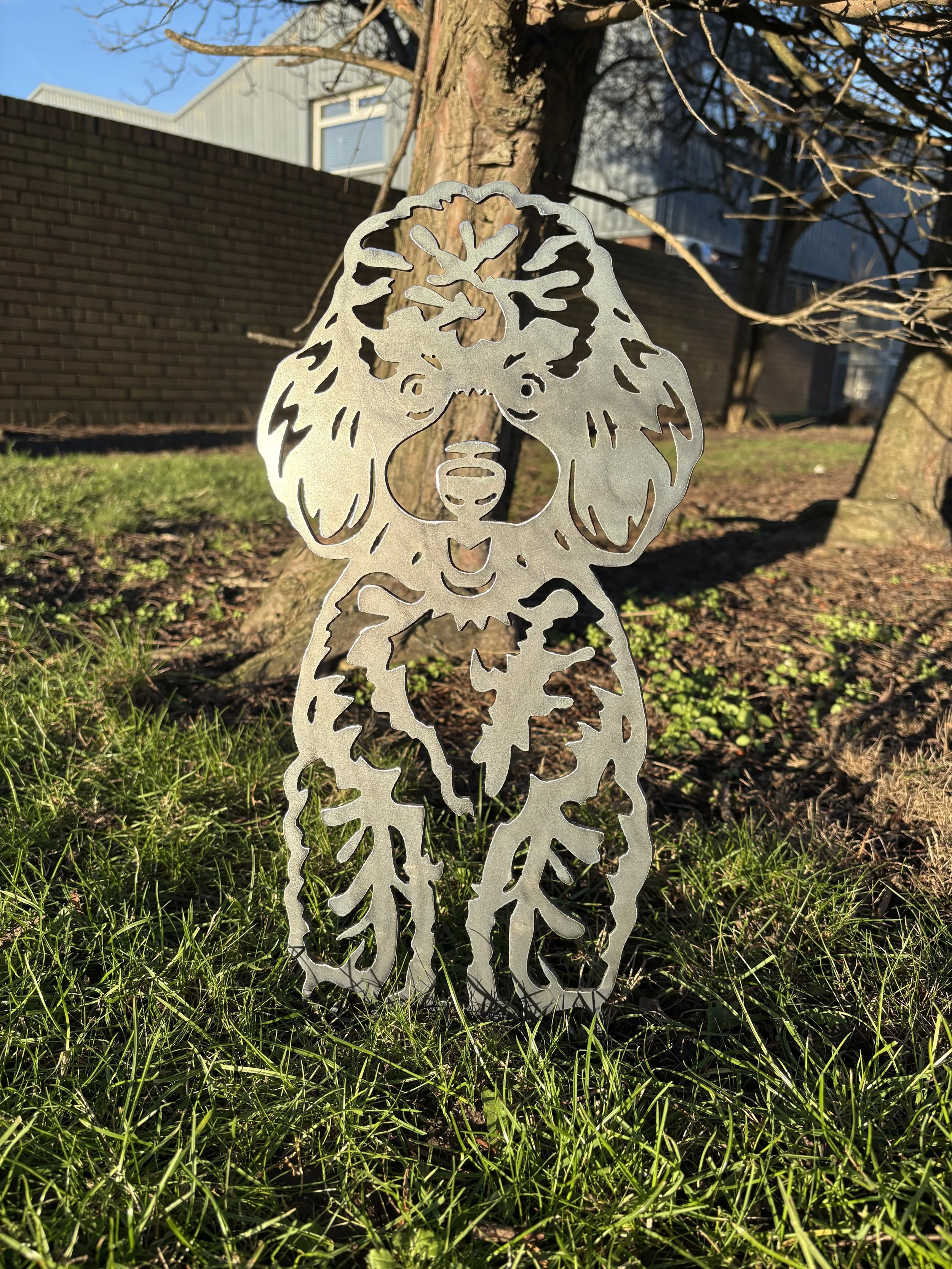 Poodle metal dog garden ornament crafted from steel, combining durability, rustic style, and love for dogs in one design.