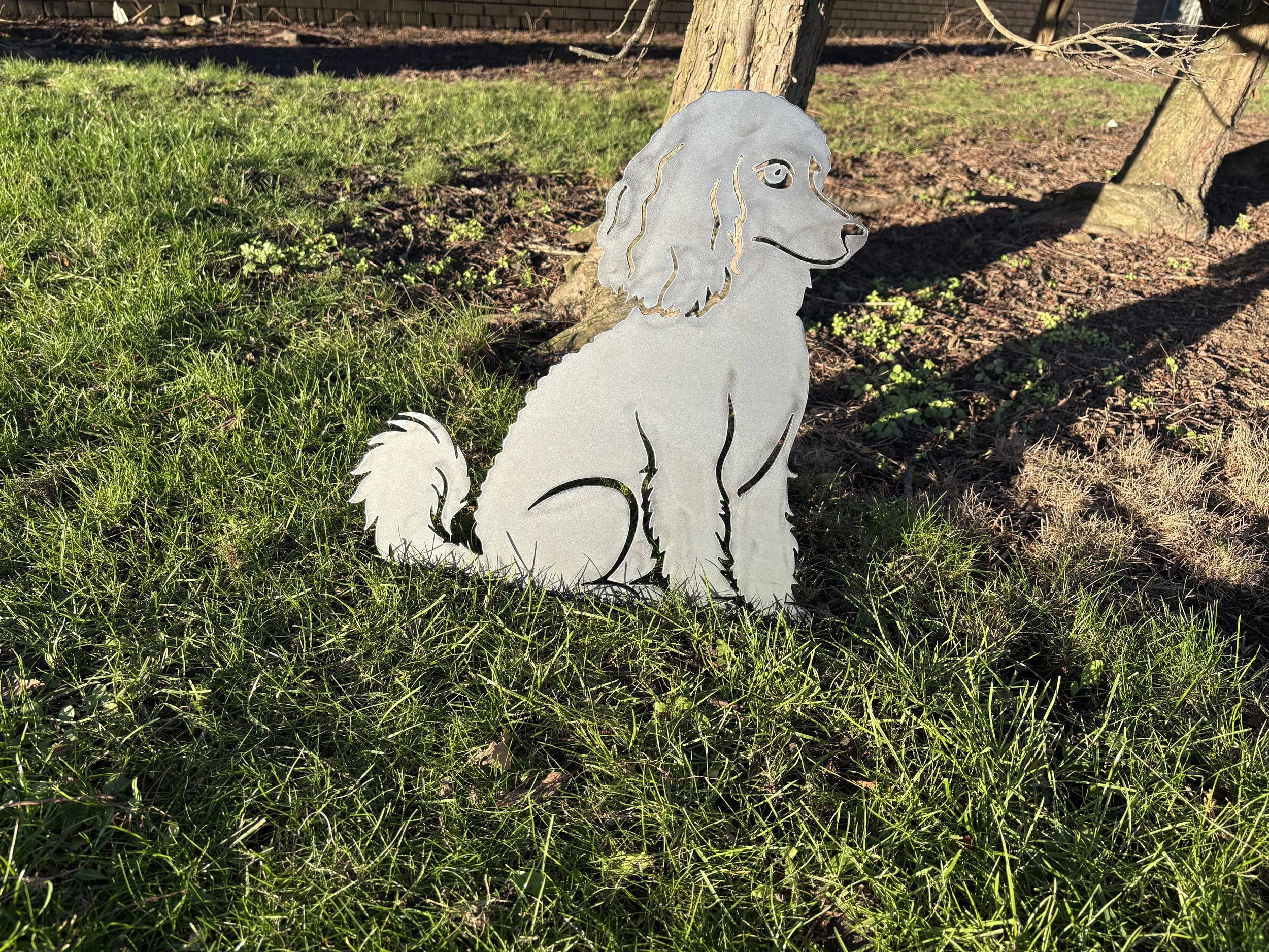 Sitting poodle metal dog garden art crafted from mild steel, combining durability, elegance, and rustic style.