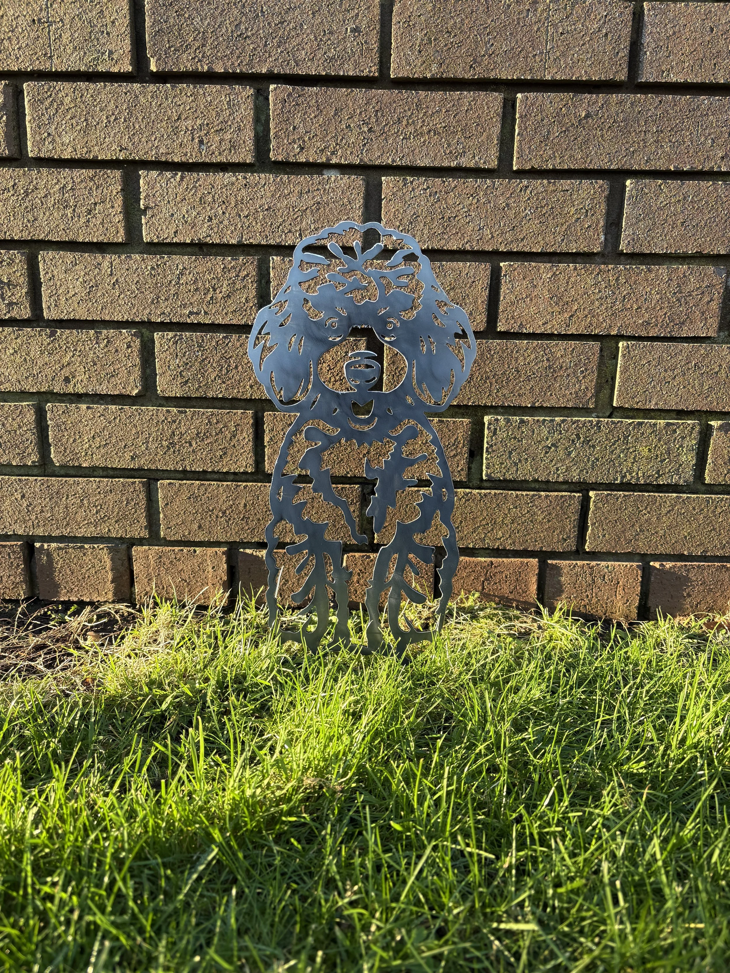 Rustic metal poodle garden decoration designed for outdoor display, offering long-lasting durability and timeless character.