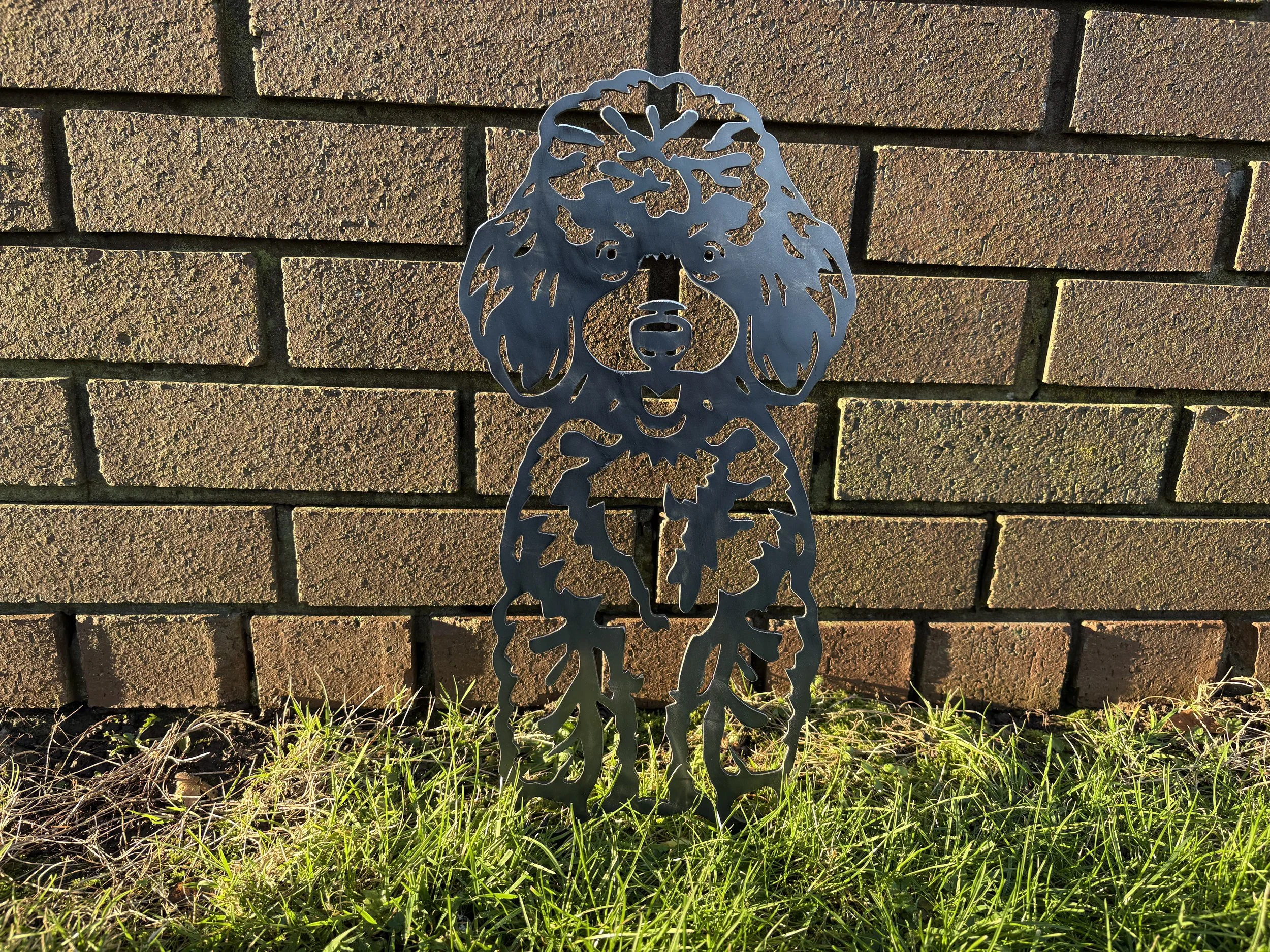 Metal poodle dog garden art silhouette with a classic pose, ideal for dog lovers seeking unique rustic outdoor décor.